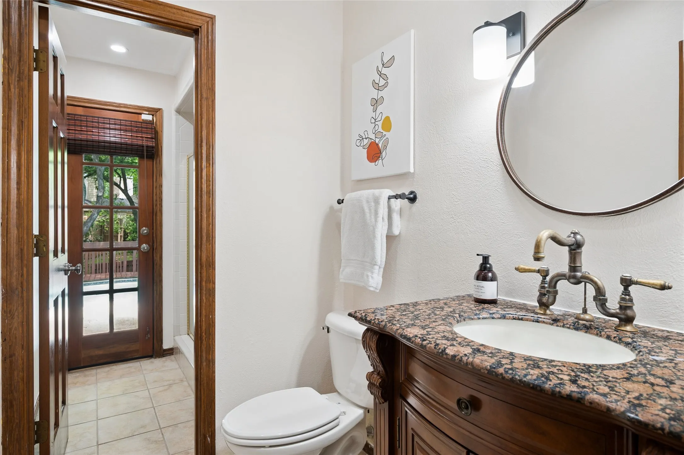 Full pool bath with shower sits just off the study and living are with direct access to pool and back yard.