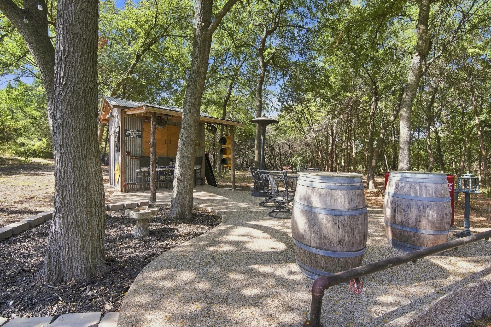 A serene, tree-shaded corner of the yard offering your own private outdoor retreat.