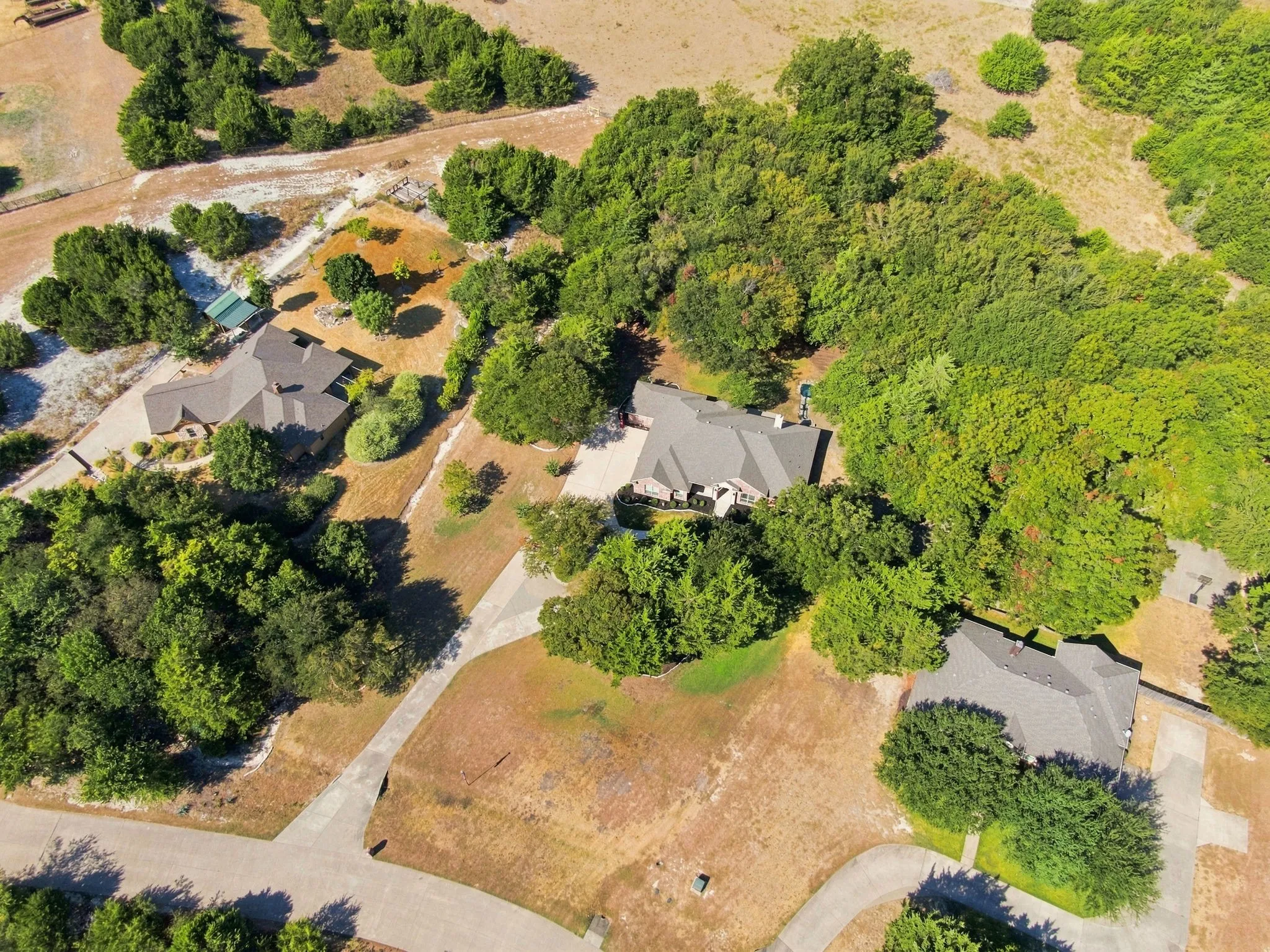 Extensive treed lot with a private driveway, offering exceptional privacy and natural beauty.