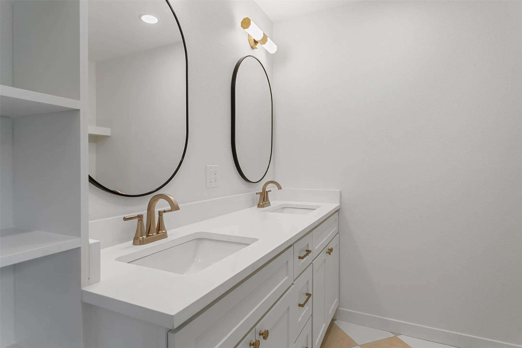 Dual vanity with integrated sinks and white countertops