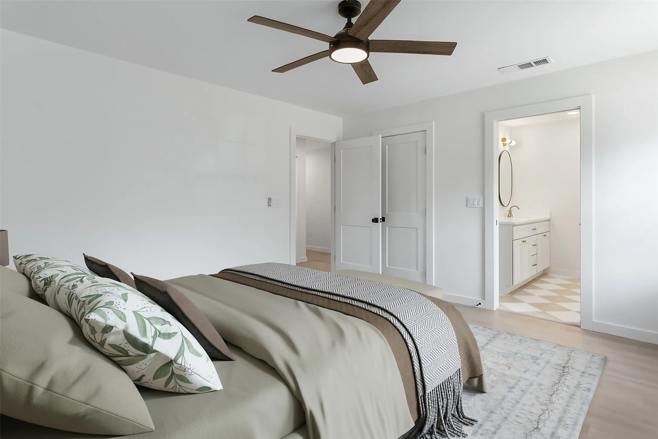 Wood-finish flooring with a ceiling fan overhead