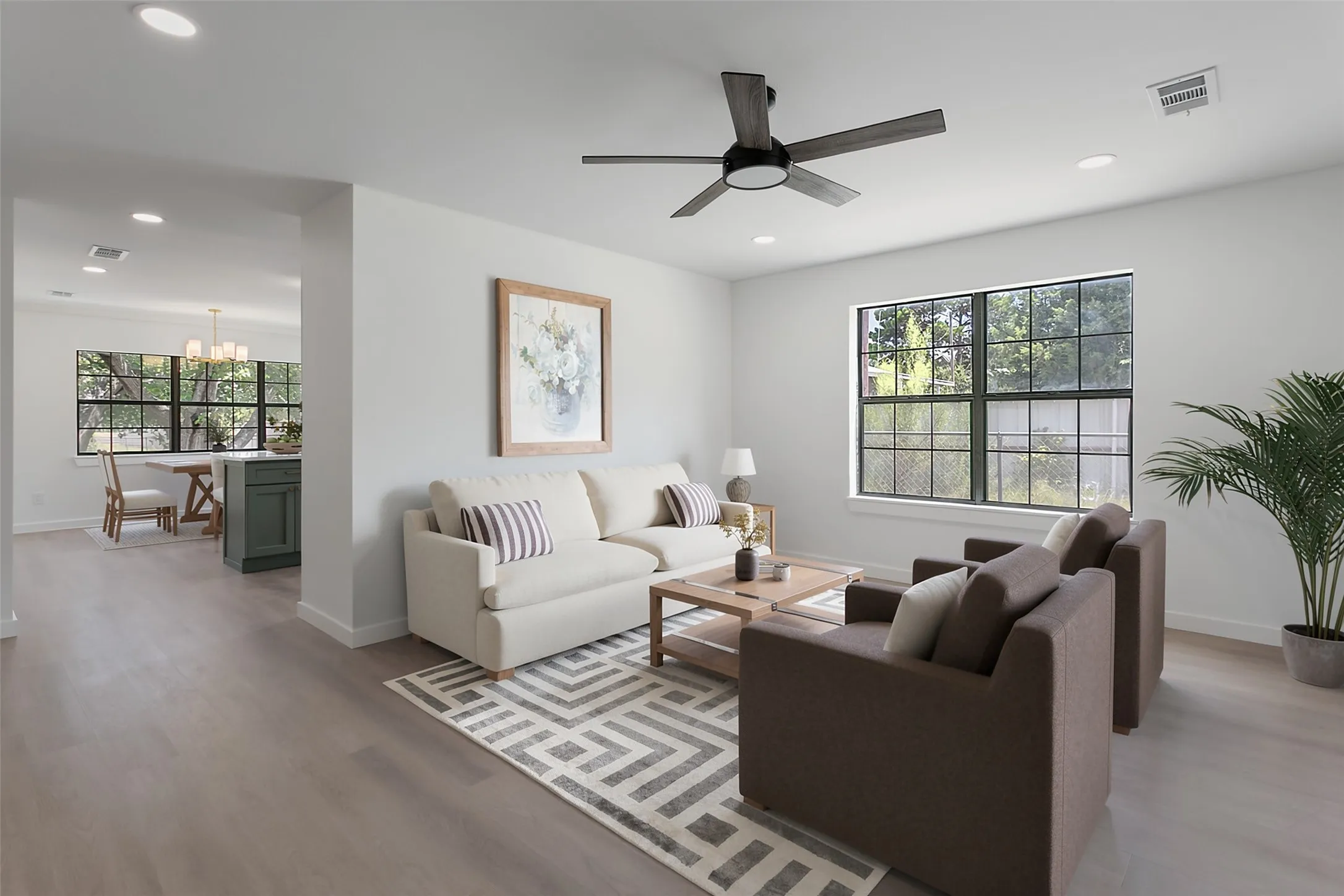 Recessed lighting throughout, wood-finish flooring, and a ceiling fan with light
