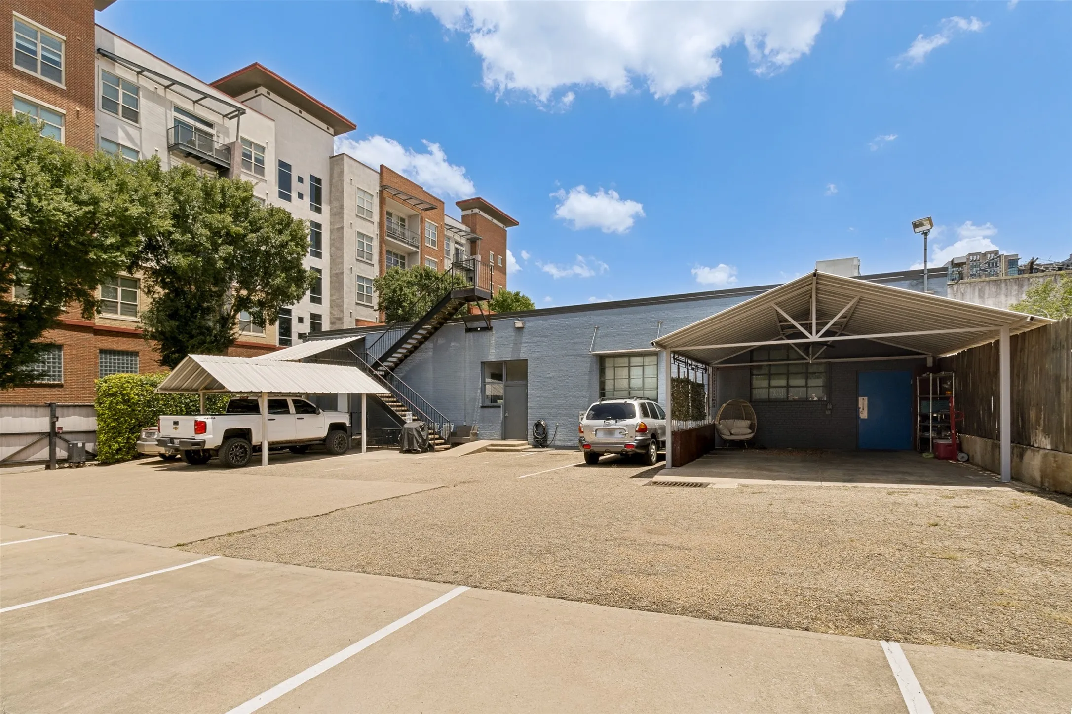 Gated Parking lot in the back with 1 assigned uncovered space and 2 guest spots