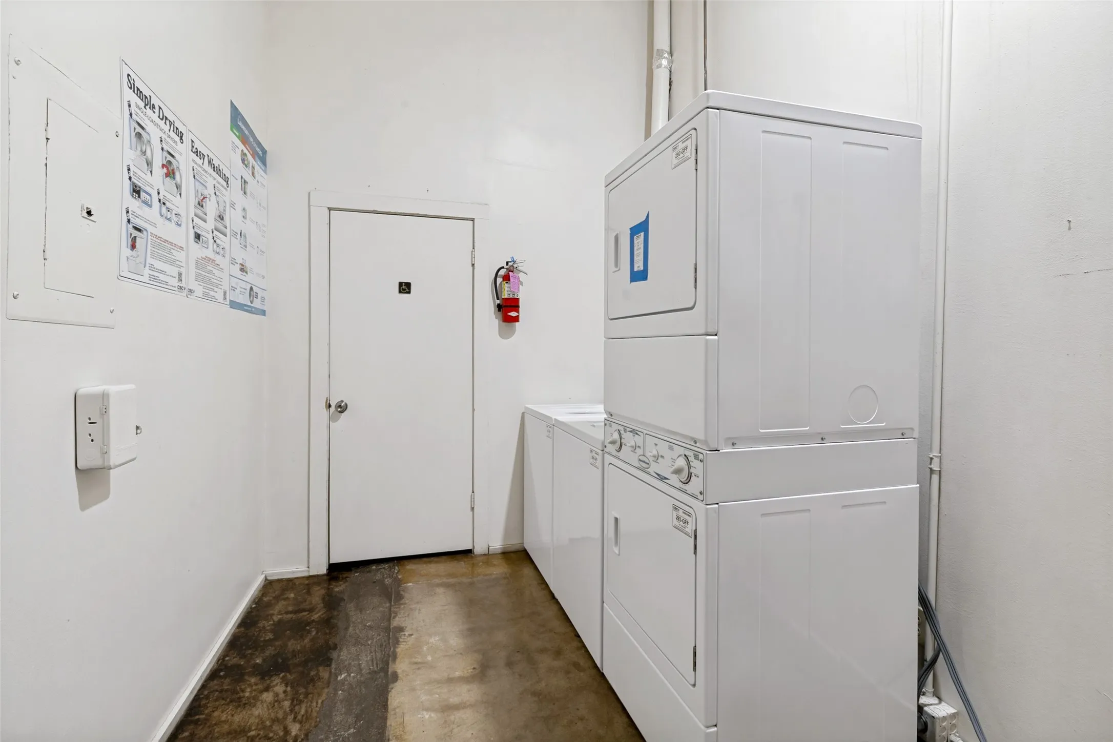 Community laundry room with storage next to unit 1