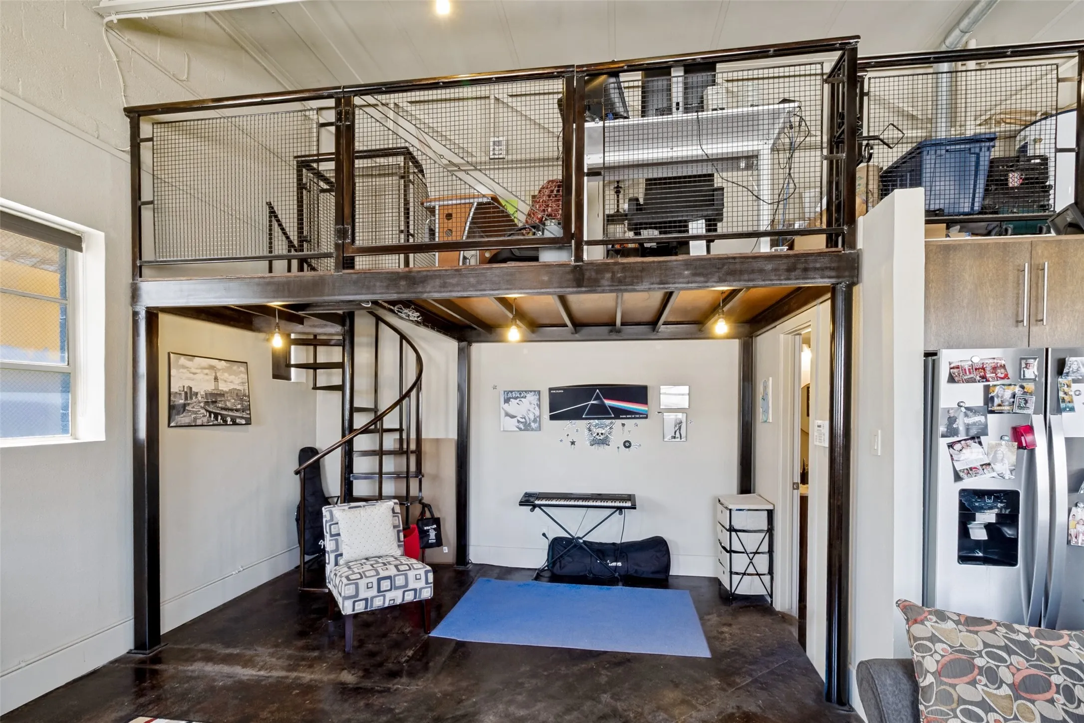 Spiral Staircase with opening to left to move things to upper area. To the right entrance to Bathroom