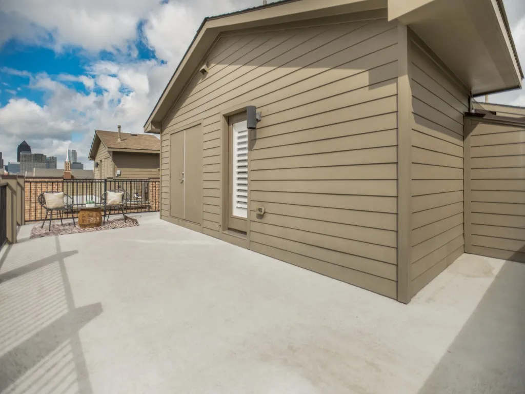 Expansive roofdeck wraps around and has additional storage