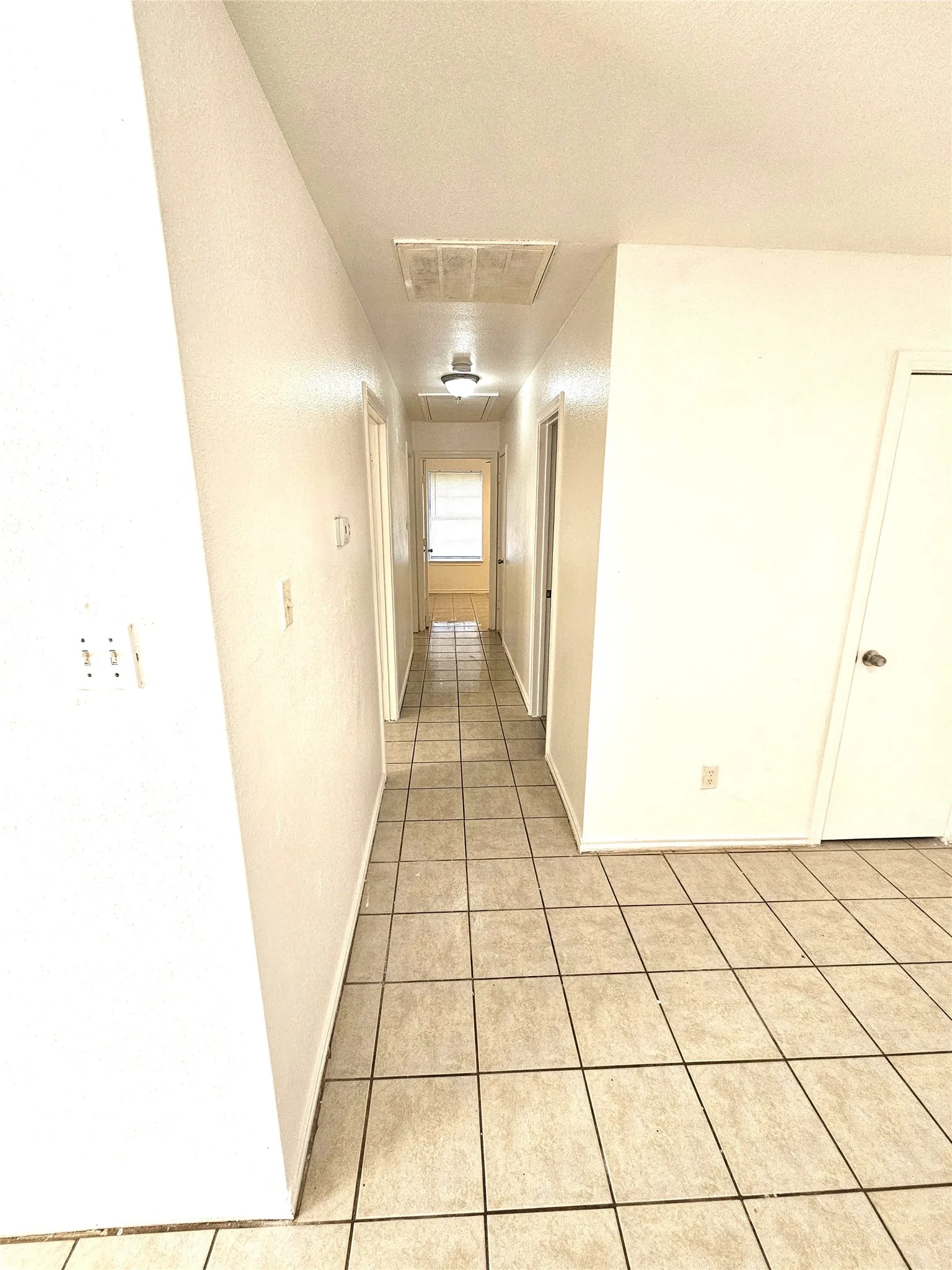 hallway to the 3 bedrooms and full size bathroom