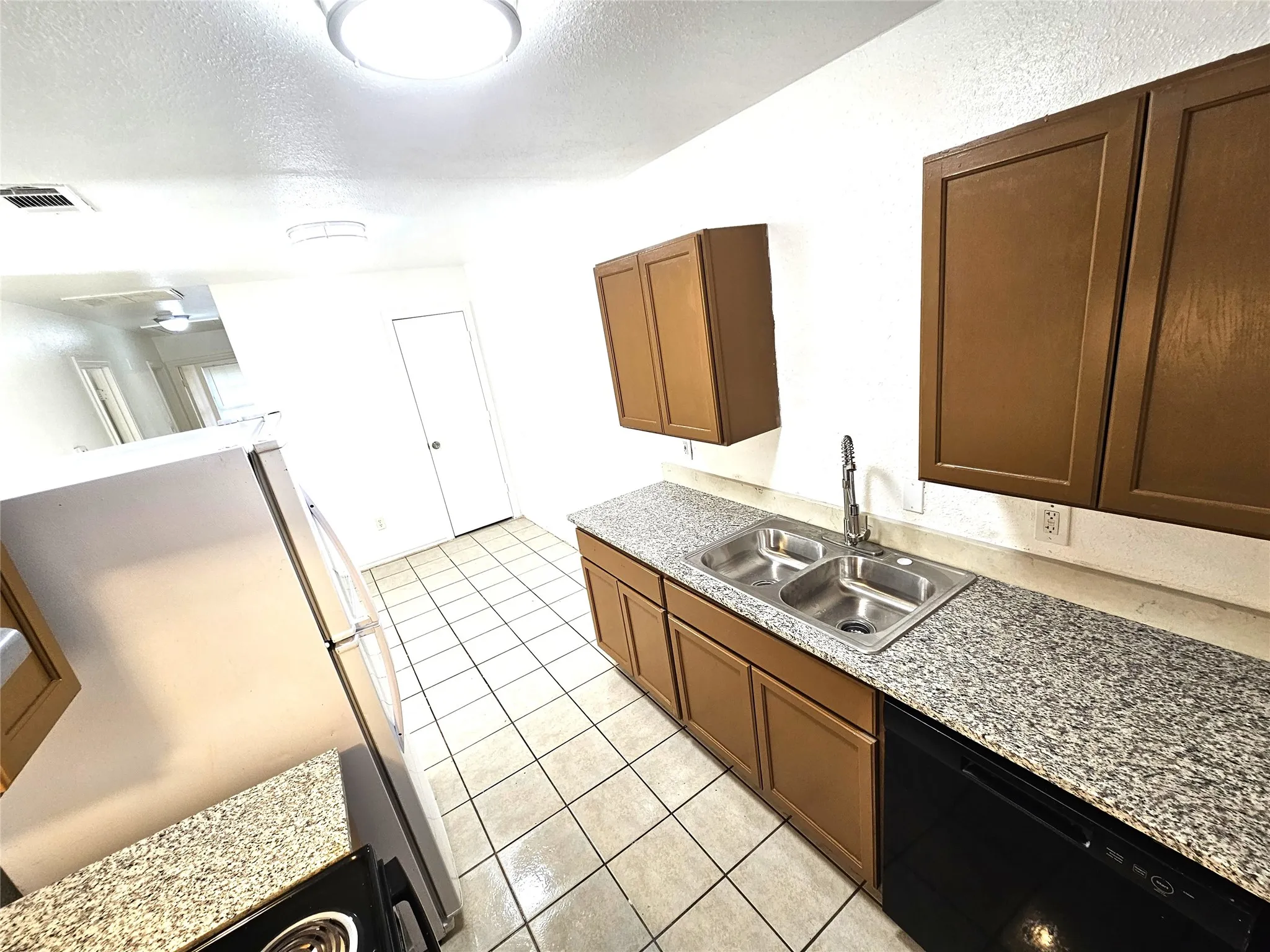 Kitchen featuring granite countertop, new sink, kitchen faucet, new modern lights