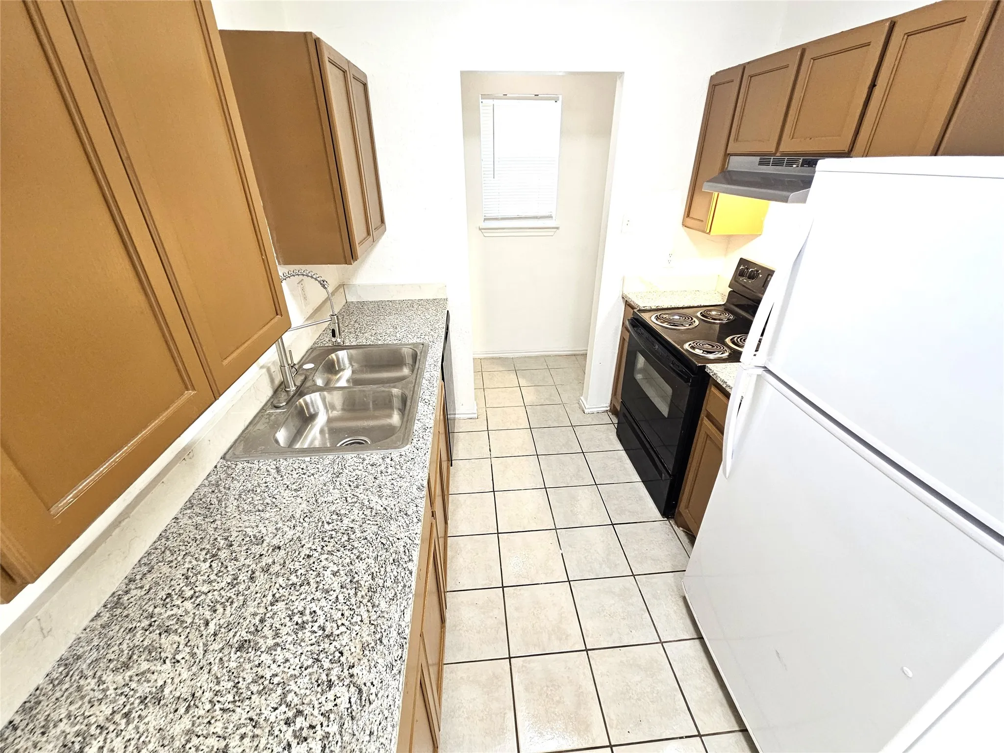 Kitchen featuring granite countertop, new sink, kitchen faucet, new modern lights