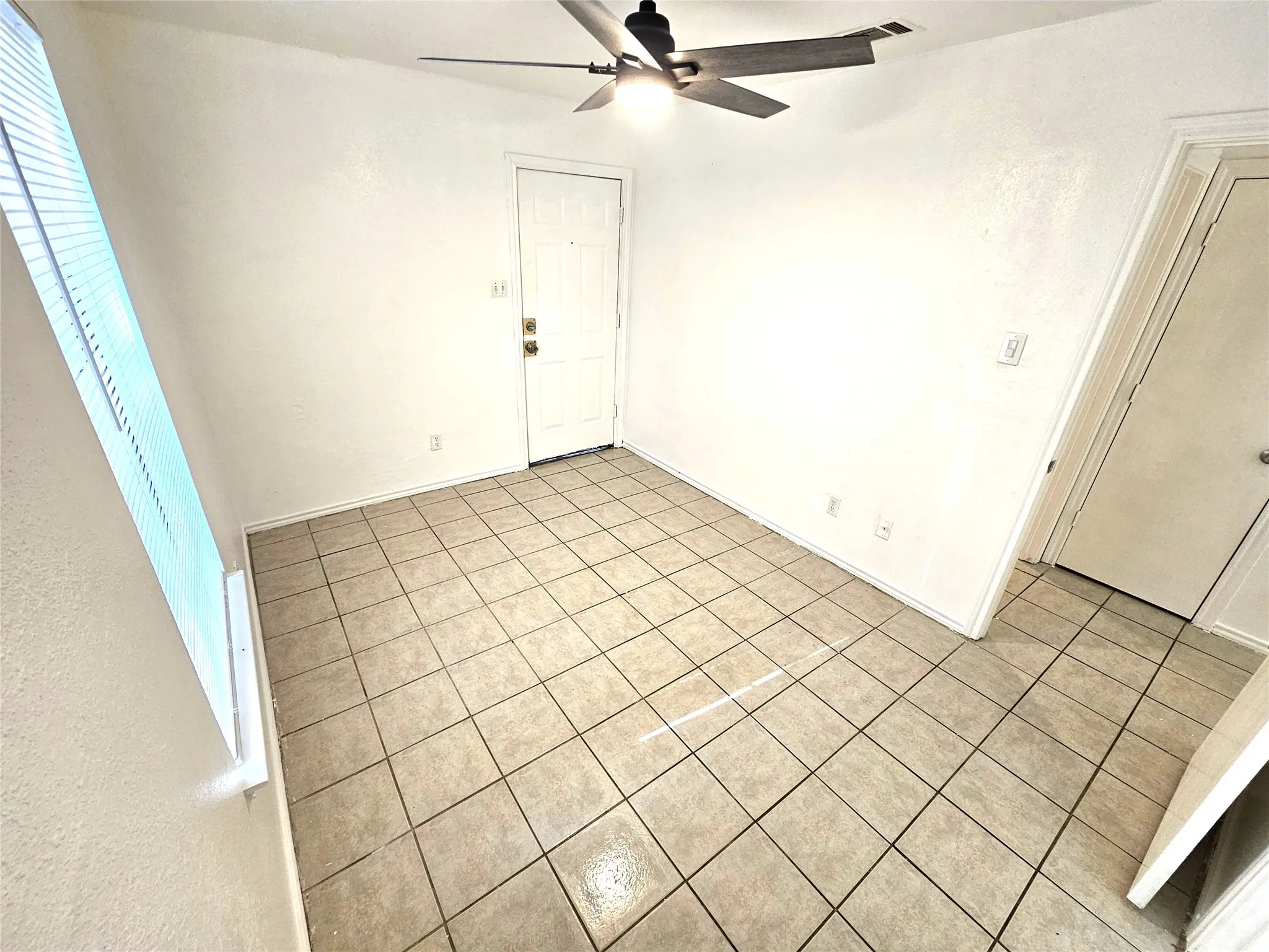 Master bedroom with half bath and a door access to backyard
