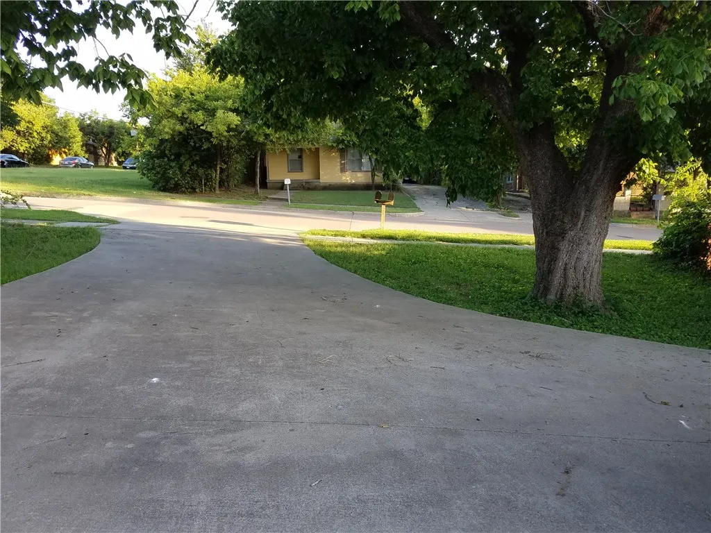 this is the driveway of the brick duplex (not shown in the pic).