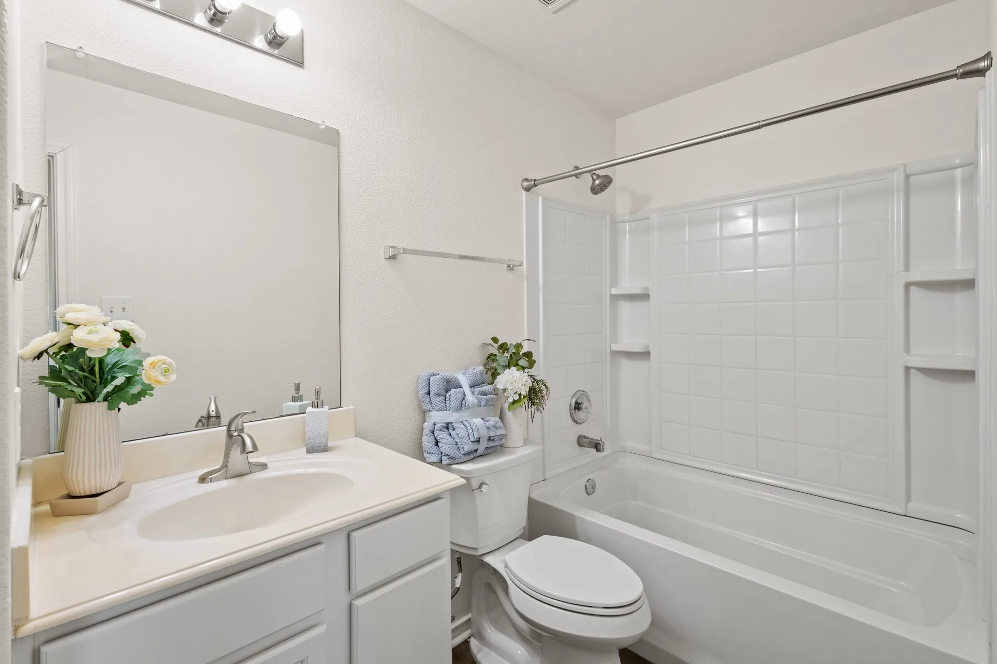 Bathroom vanity with integrated sink and chrome faucet