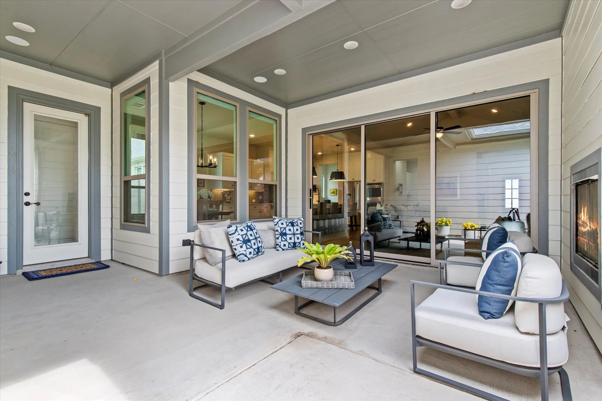Sliding glass doors open from the Living Room to the cozy rear patio.  Also includes an outdoor fireplace.