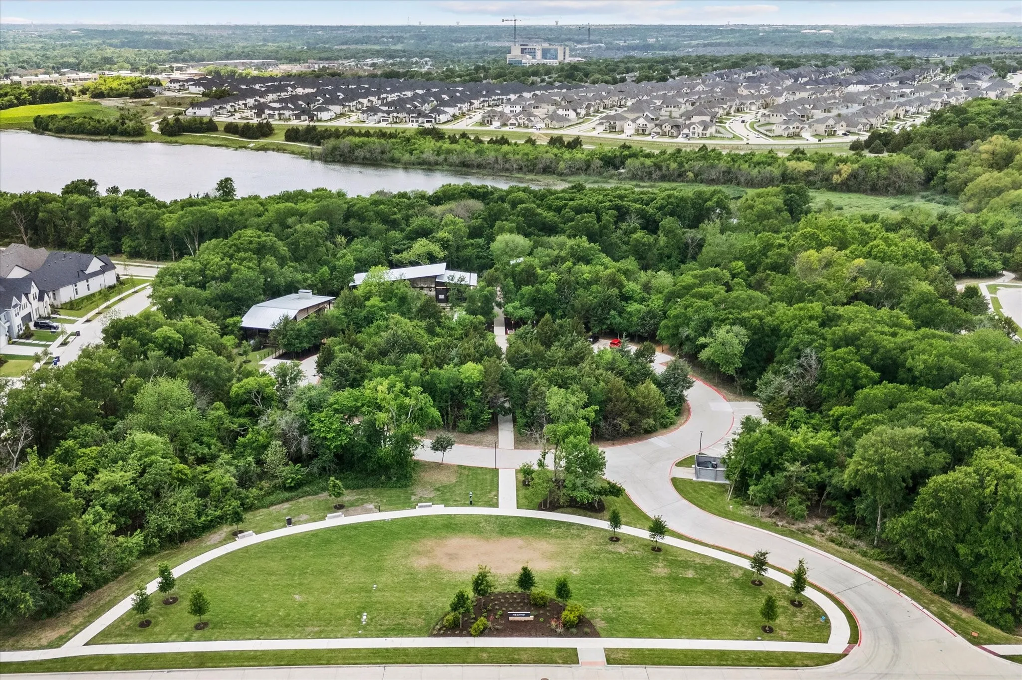 Across the street from the home is a park area Located in the Lakeside District. This National Park-inspired center features an expansive covered porch for events and concerts, a lookout tower, a play area, and a food truck court.