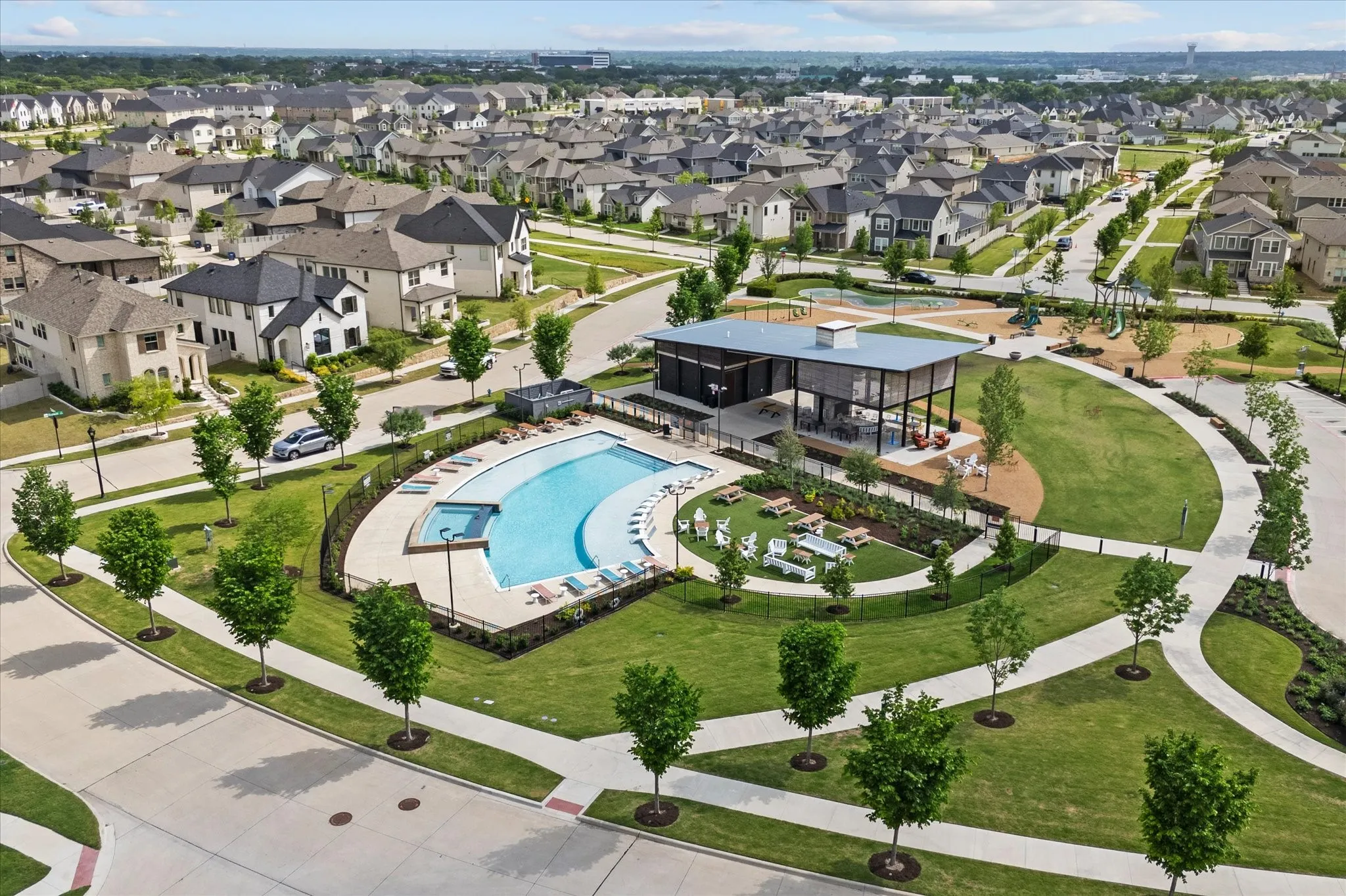 Community amenities featuring a swimming pool, clubhouse, and recreation area with playground
