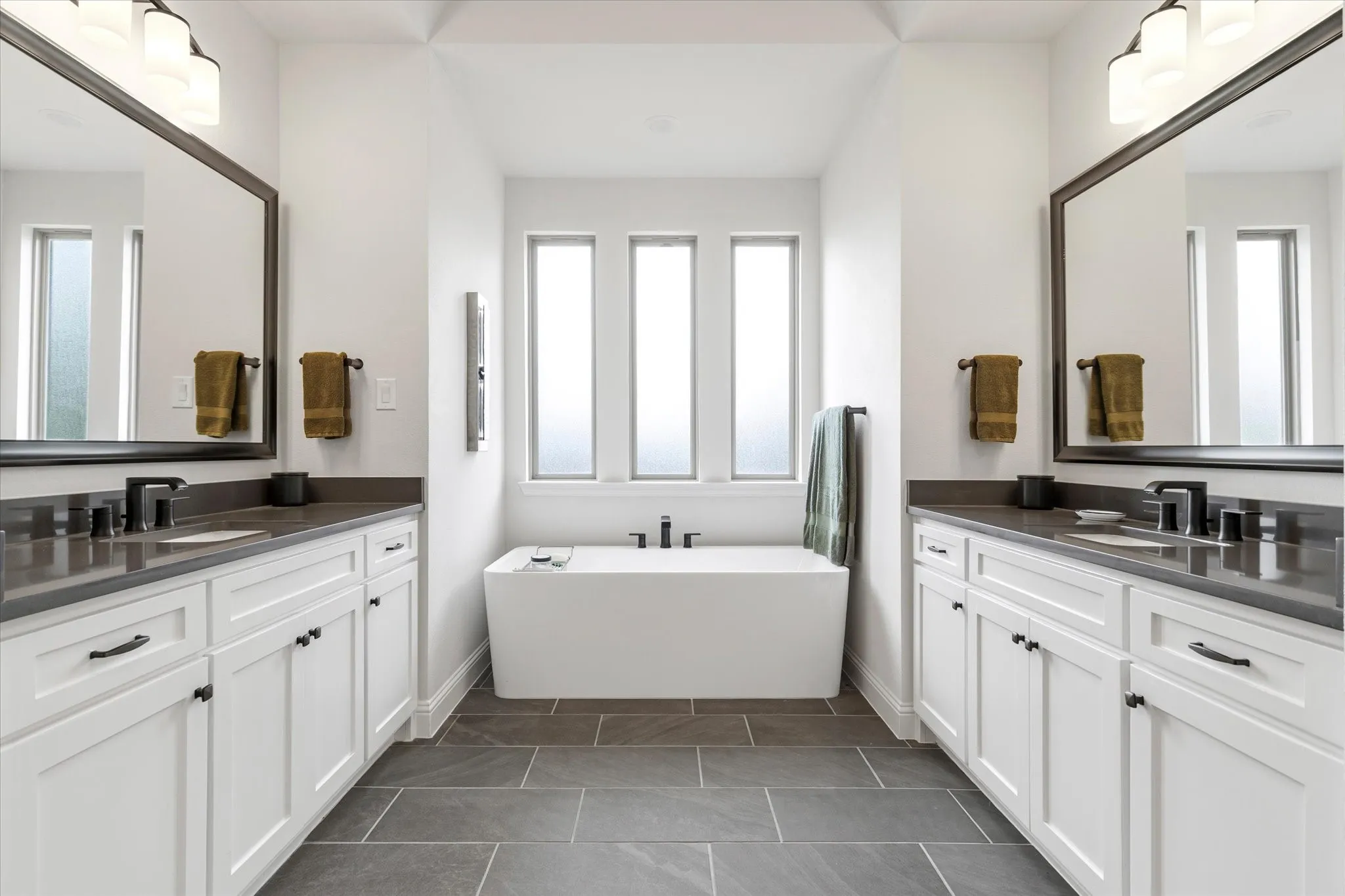 Primary Ensuite Bathroom has dual vanities, lots of cabinet space and Gorgeous Garden Tub.  It also has a separate shower and large walk in closet.