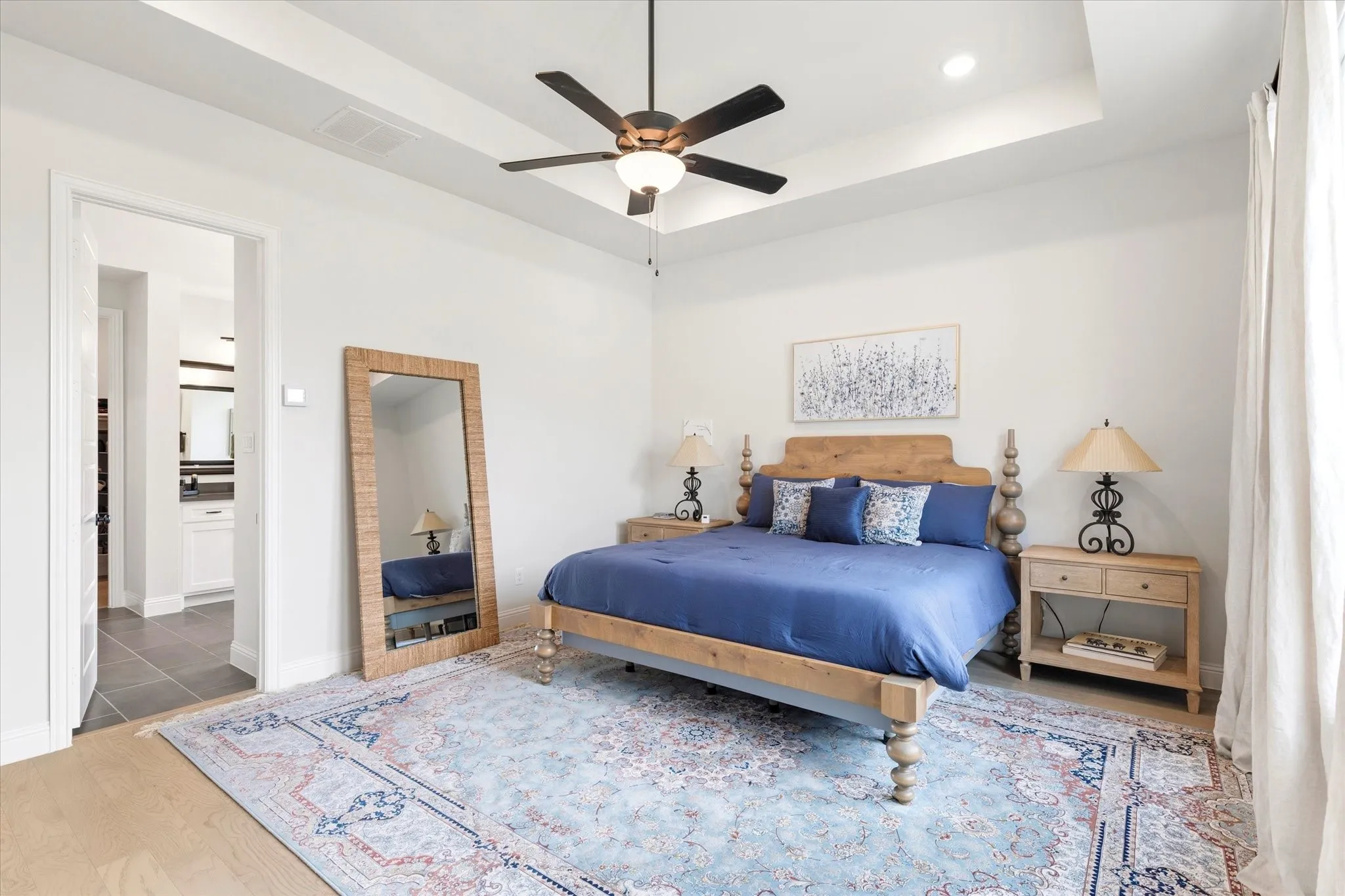 Primary Bedroom has large windows, a tray ceiling and beautiful Primary Ensuite Bathroom.