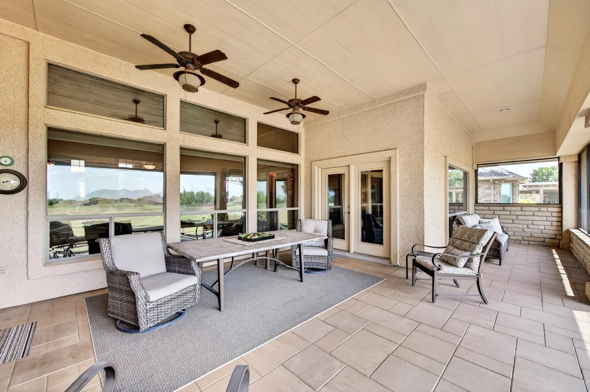 You'll enjoy dining al fresco on this huge, covered patio as you look out onto your gorgeous golf course view.