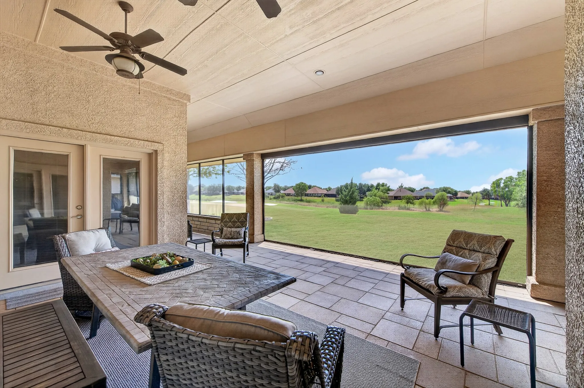 With both permanent and a remote screen, you can enjoy this back porch all year long!