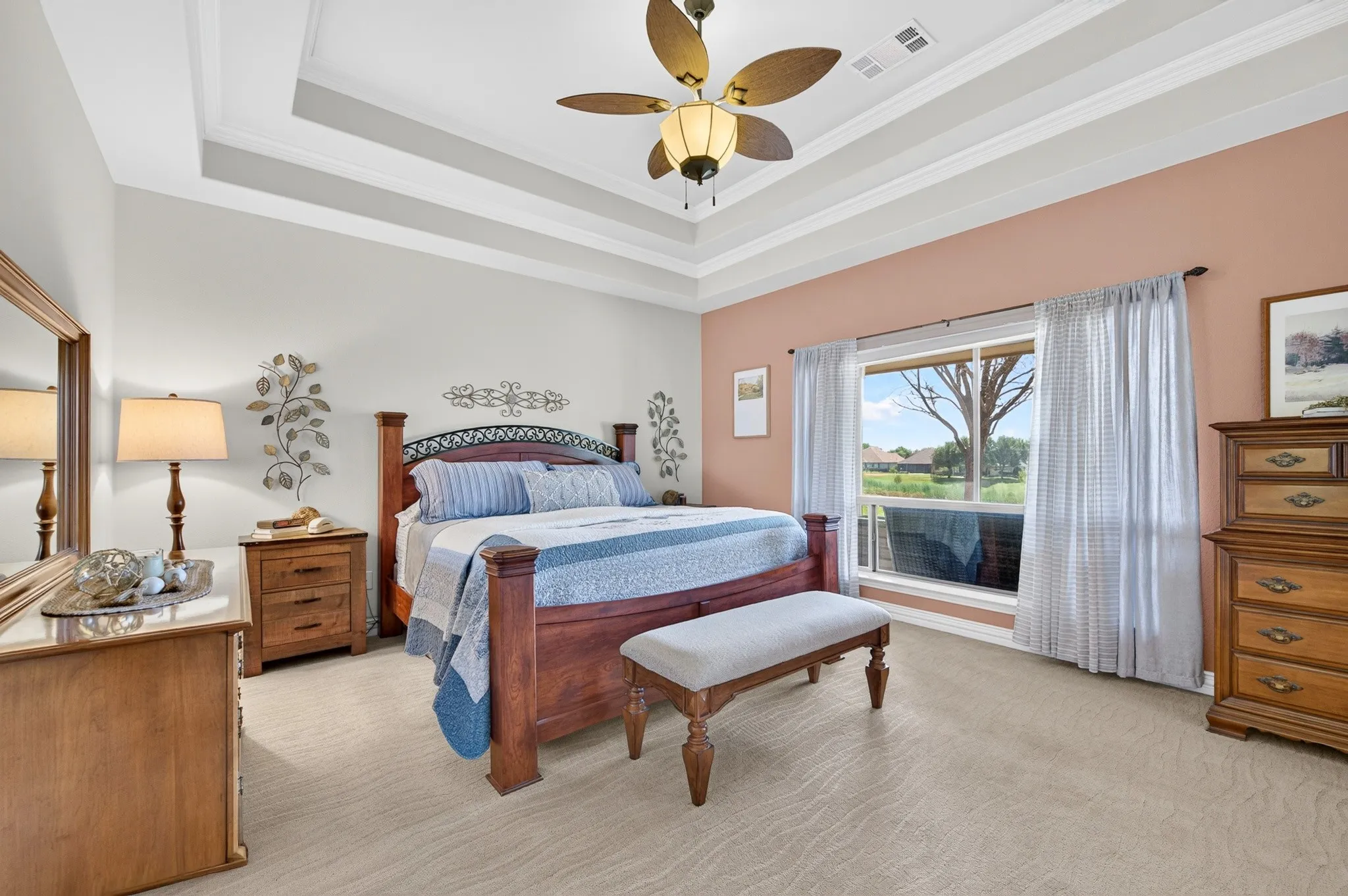 Imagine walking up to this golf course view in such an elegant bedroom.