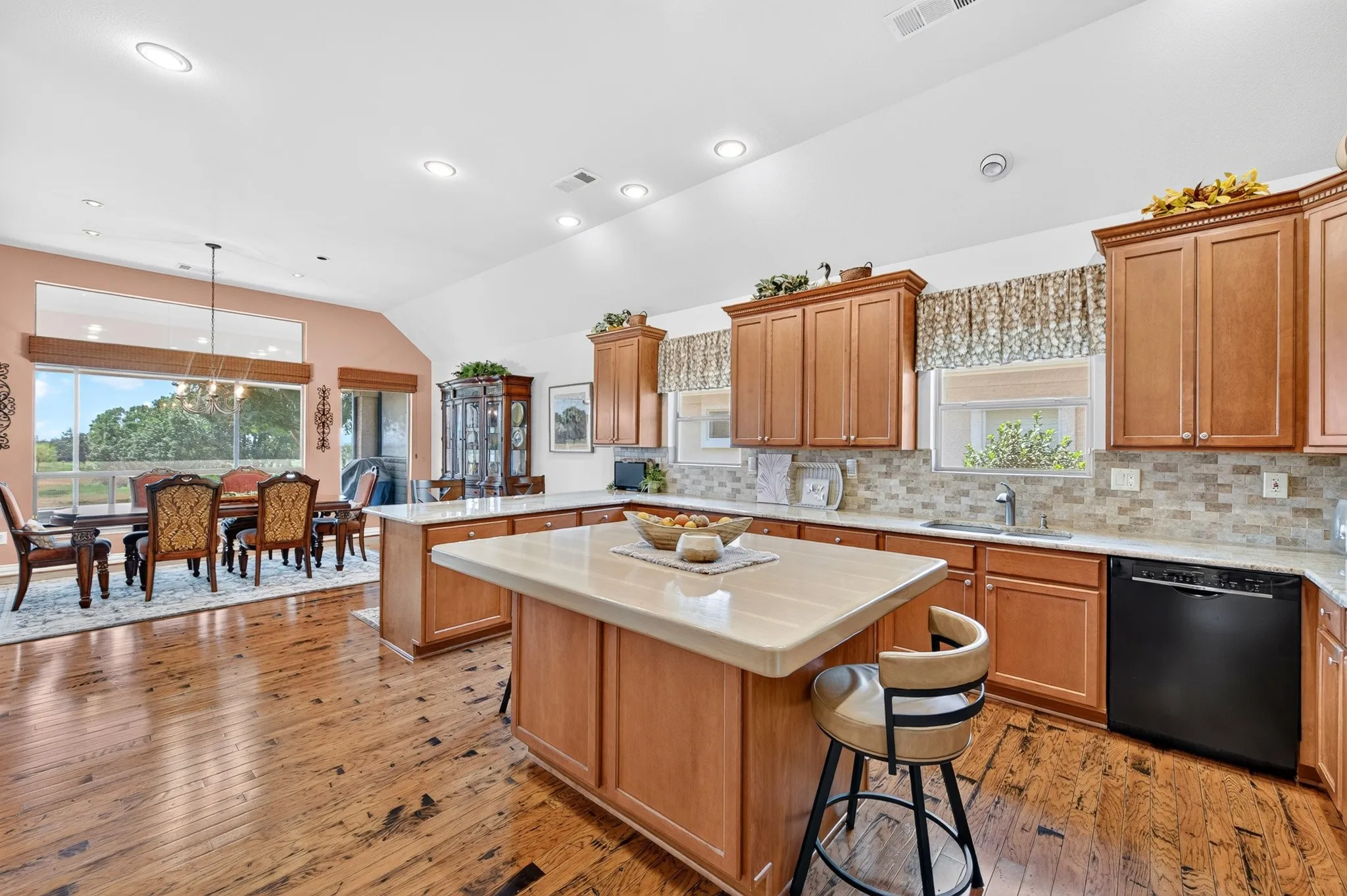 Fabulous kitchen!  FYI - The gorgeous custom-made wood top on the island creates a wonderful casual dining spot.  Or take it off and you have a gleaming granite countertop.
