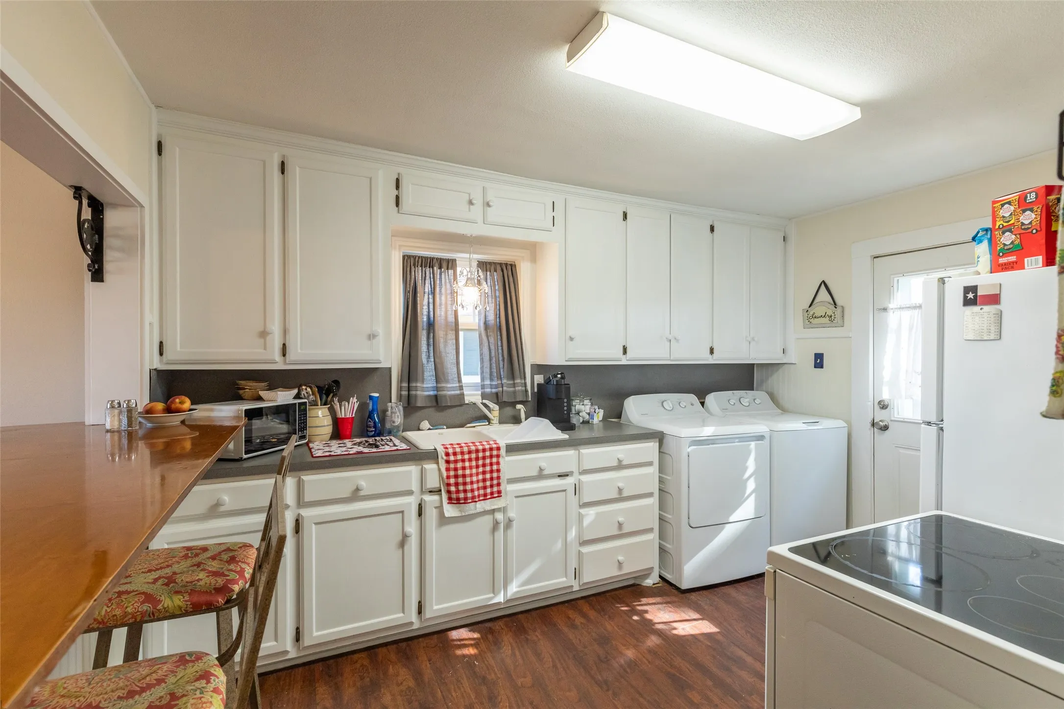White cabinetry and a built-in kitchen sink