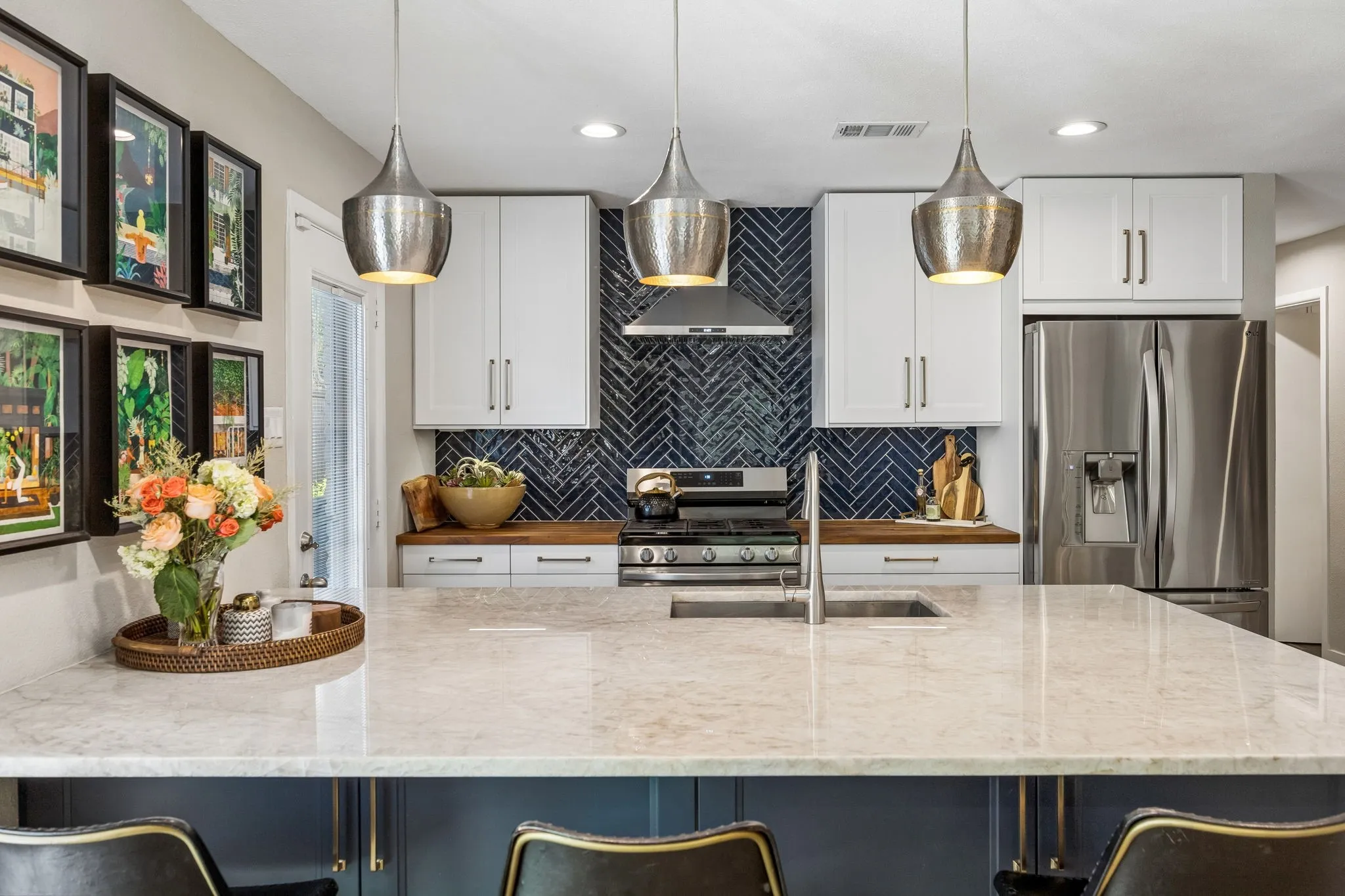 Spacious kitchen island featuring quartzite countertops