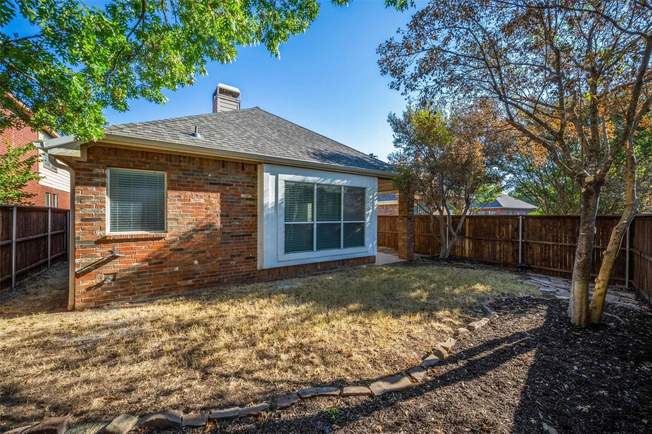 Brick exterior with a shingle roof