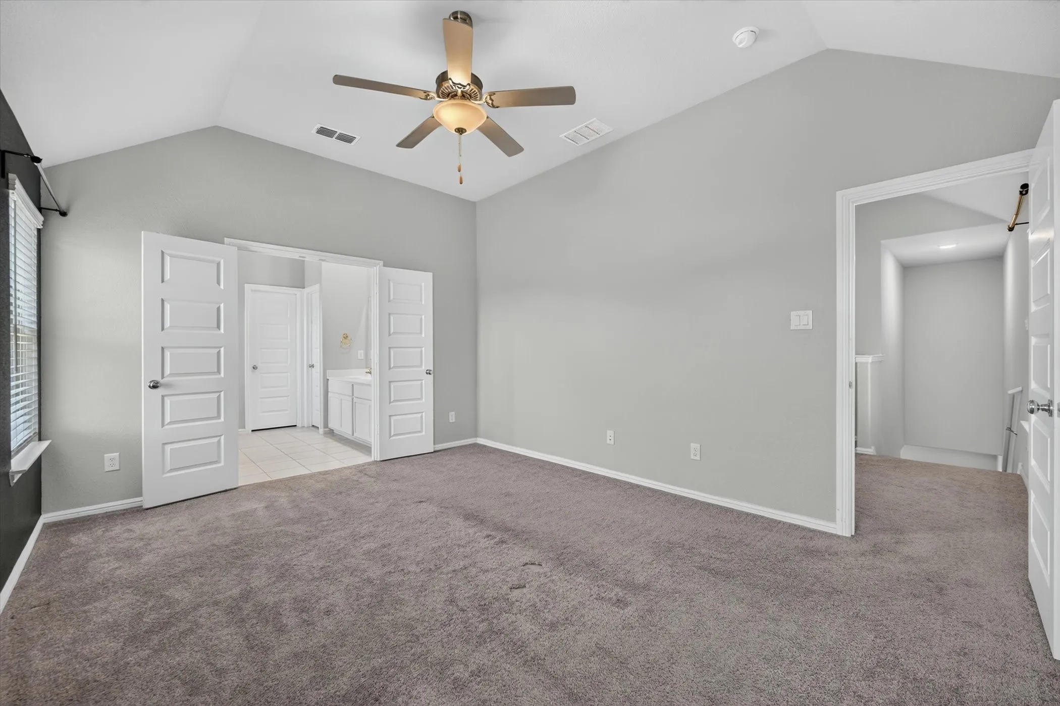 Carpeted room with light gray wall paint, recessed lighting, and an open stairwell. Carpet has been replaced!
