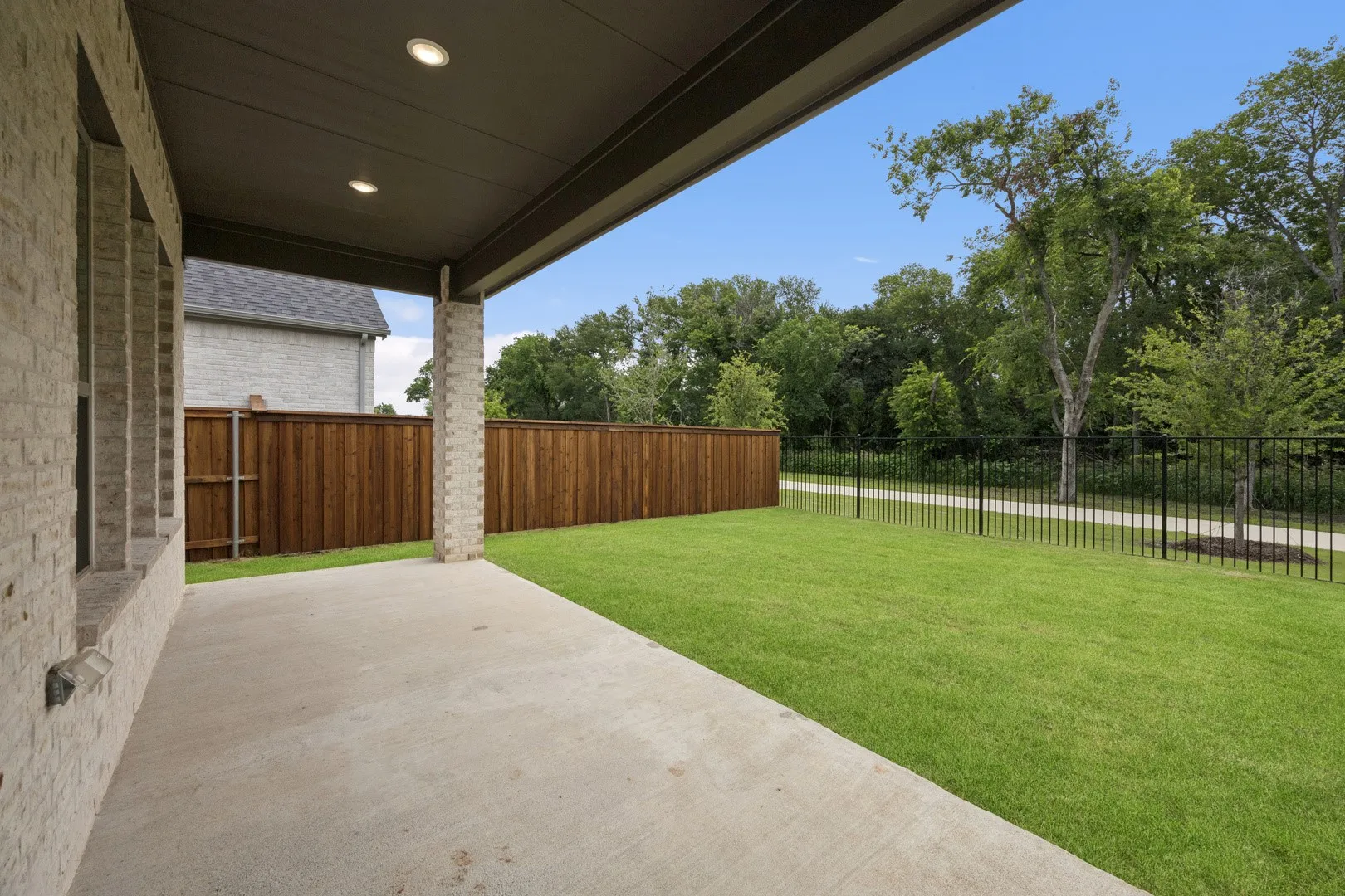 Covered Patio in the Monet II home plan by Trophy Signature Homes – REPRESENTATIVE PHOTO