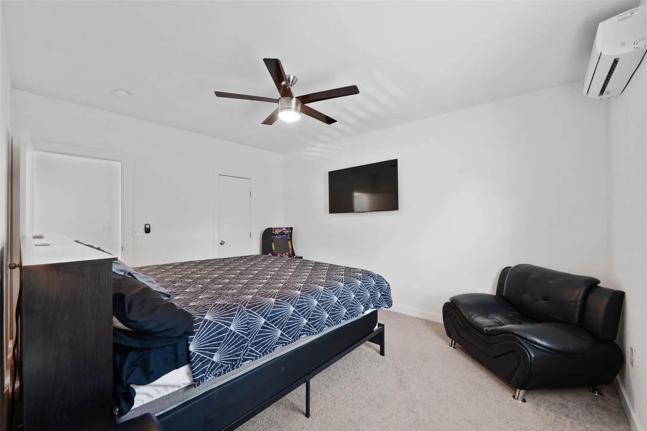 Carpeted flooring, recessed lighting, and a ceiling fan with integrated light