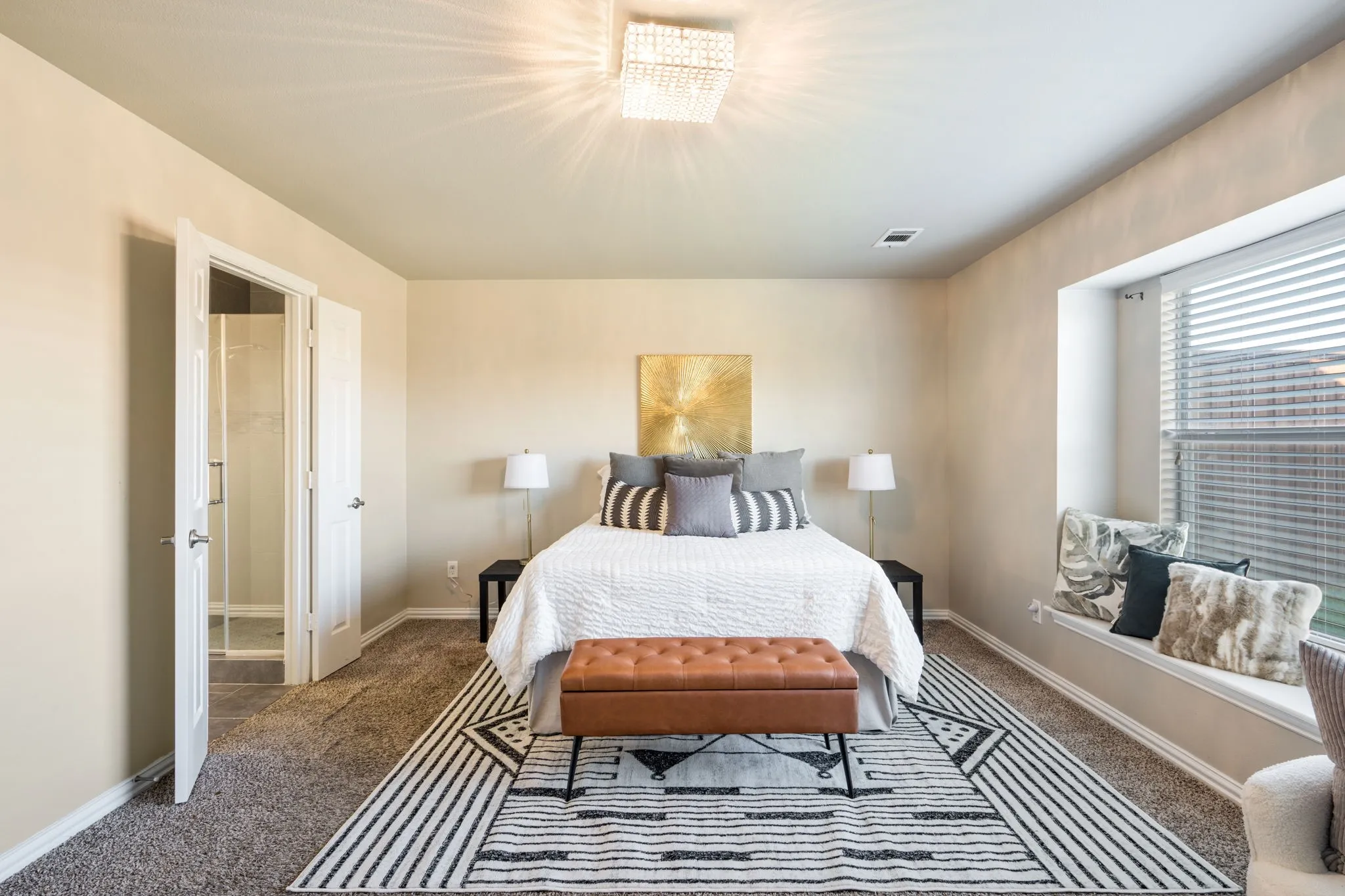 Recessed window seat, overhead chandelier, paneled interior doors, and carpeted flooring