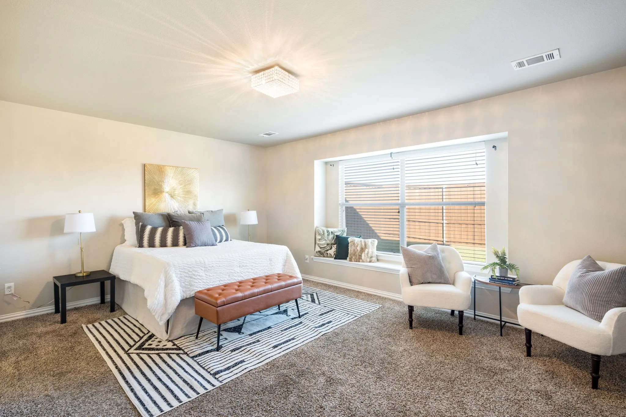 Recessed window featuring a built-in window seat, large window with horizontal blinds, and a crystal flush mount ceiling light
