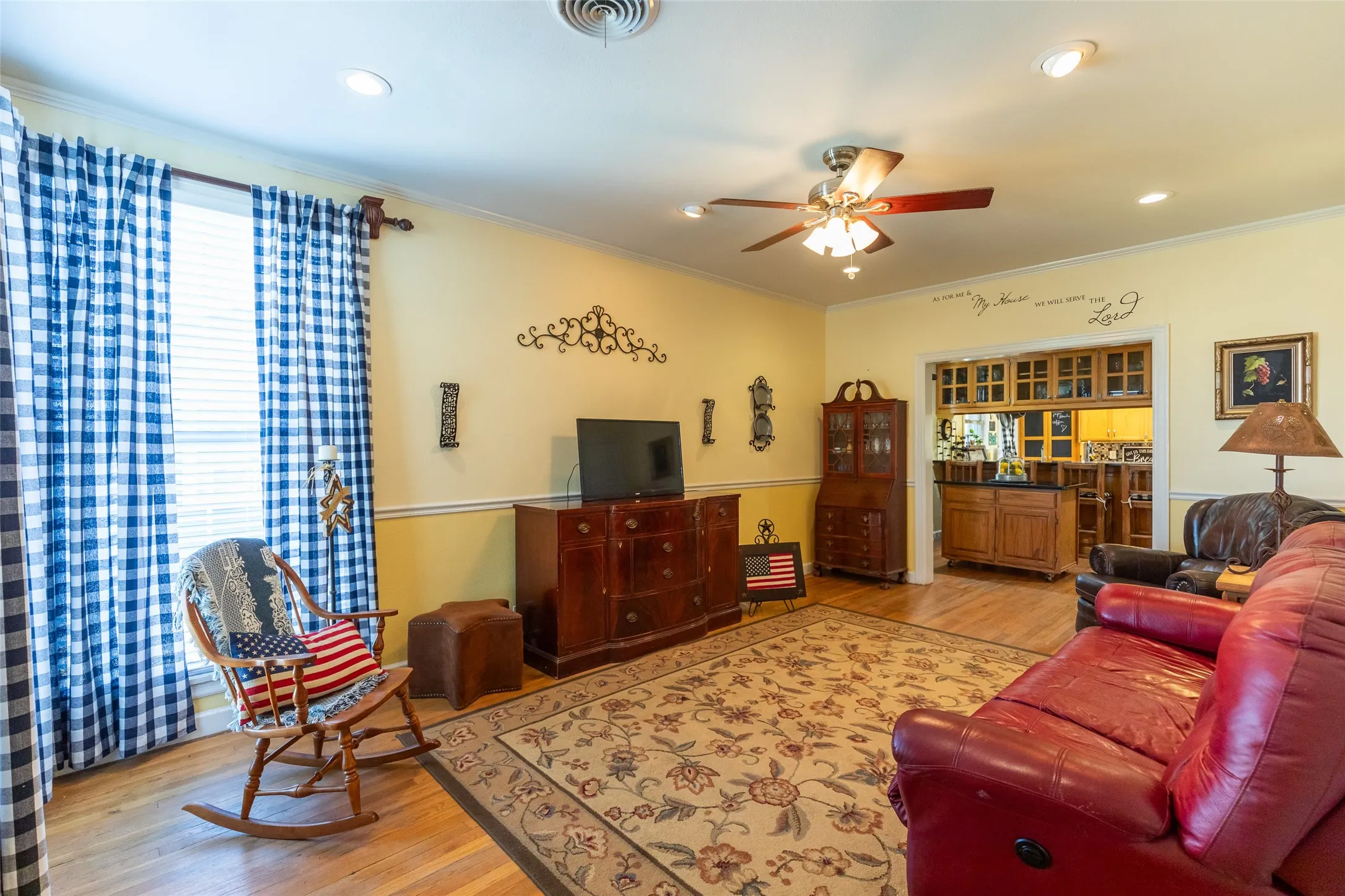 Recessed lighting, ceiling fan, wood-finish flooring, and built-in cabinetry