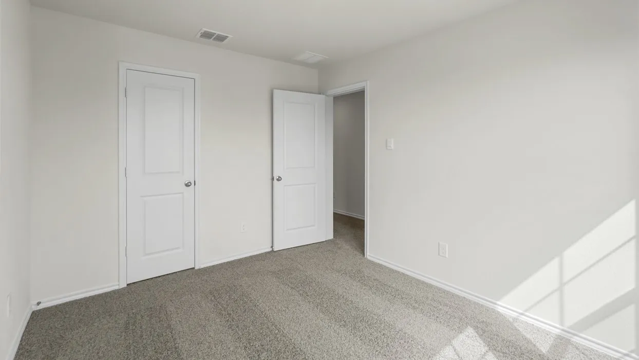 Carpeted interior space featuring white walls and white trim