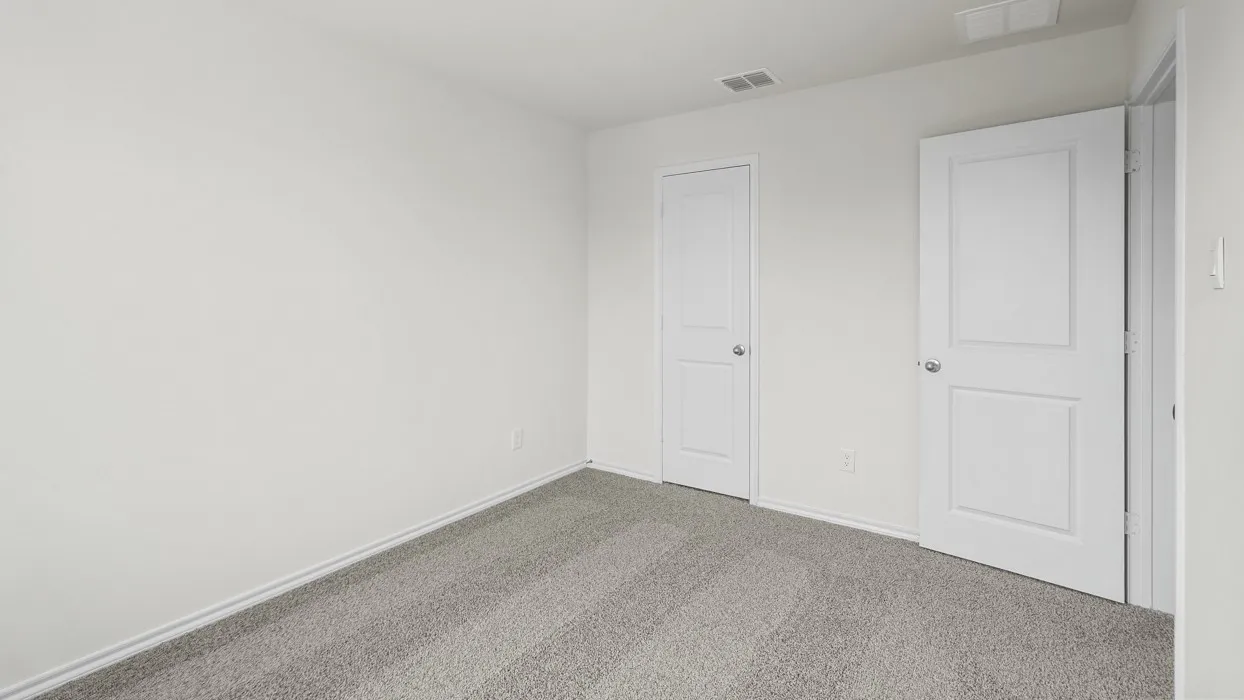 Room with light gray carpet and white walls