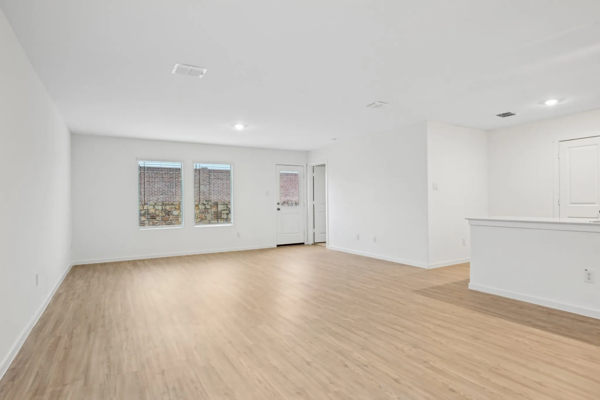 Spare room featuring light wood-type flooring