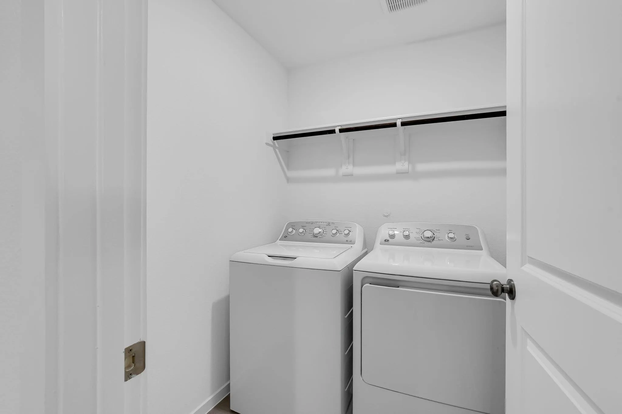 Laundry area with laundry area and separate washer and dryer