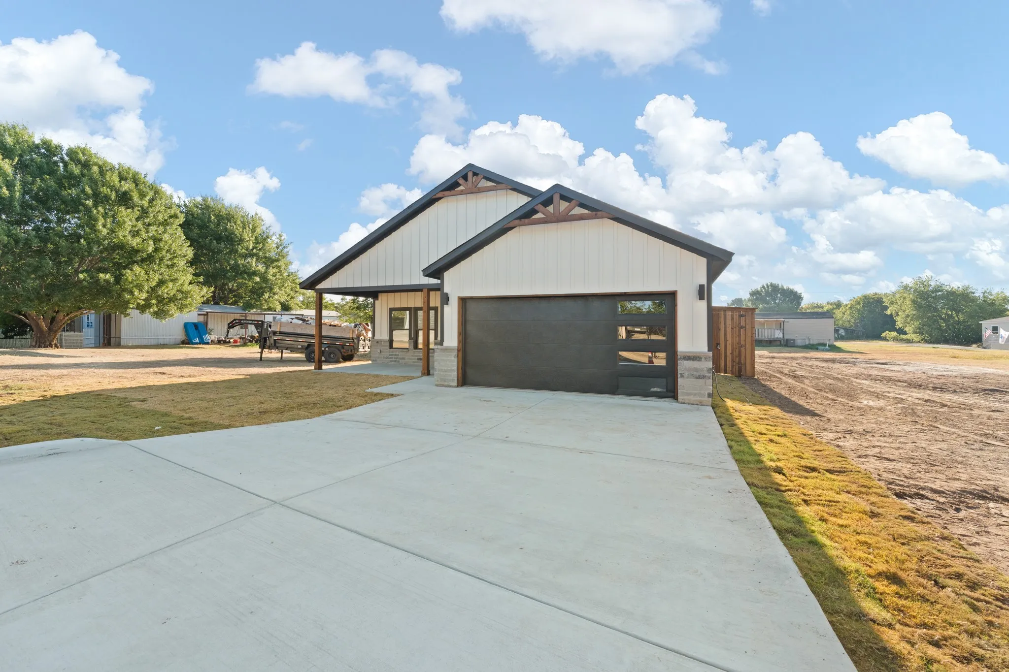 Modern farmhouse exterior with white board-and-batten siding