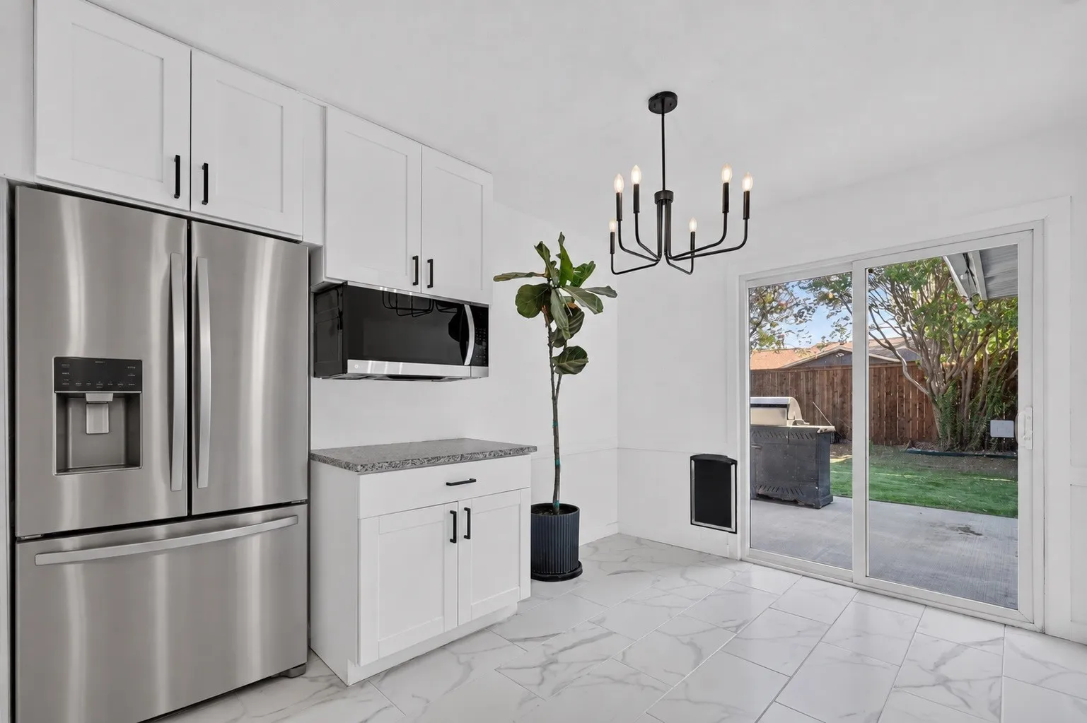 White shaker cabinetry with matte black hardware