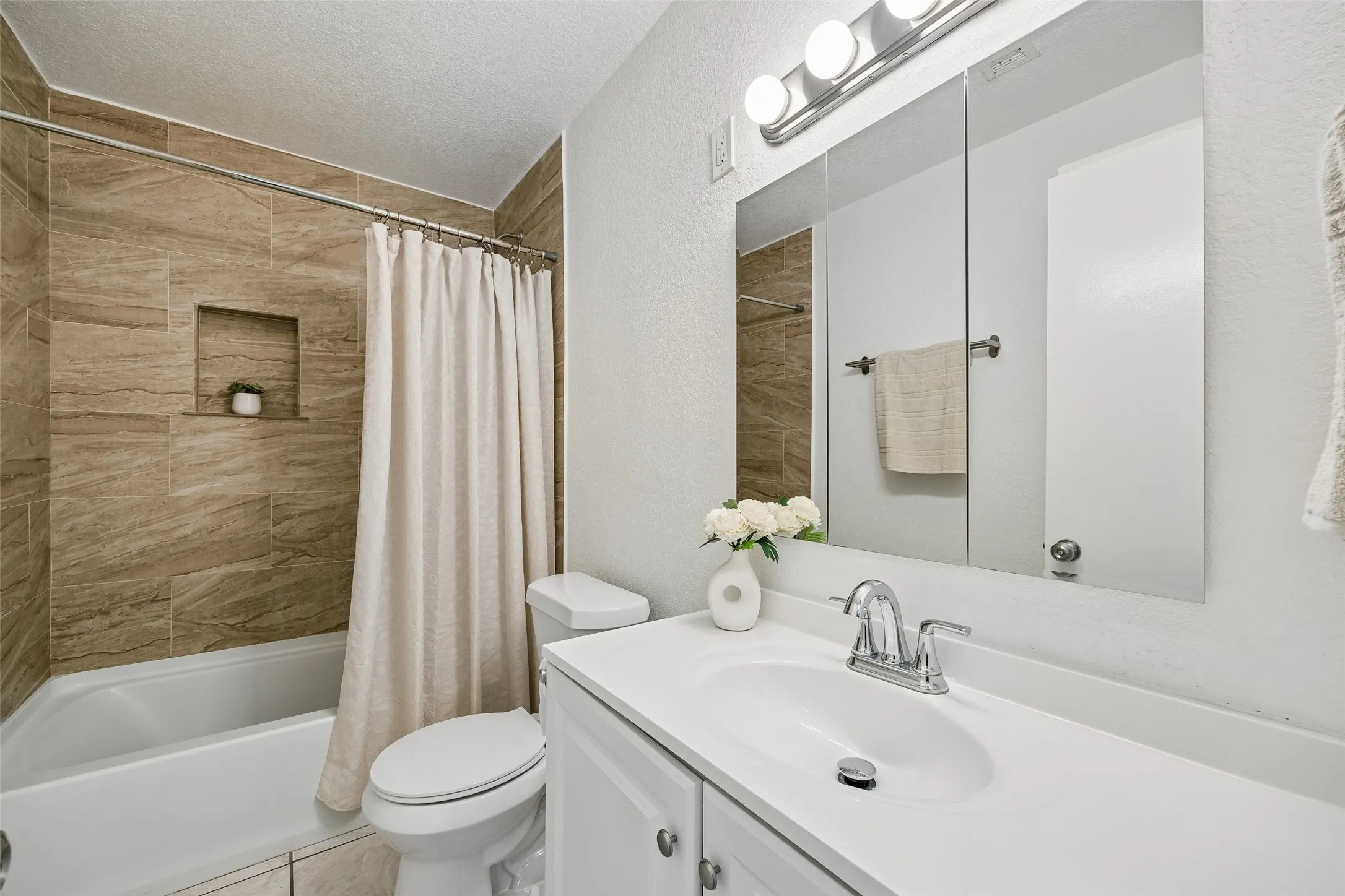 Full bathroom with hallway entry.