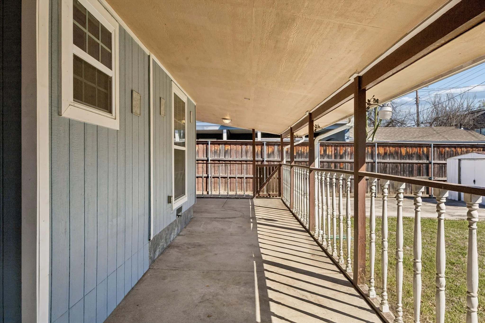 Covered patio in backyard.
