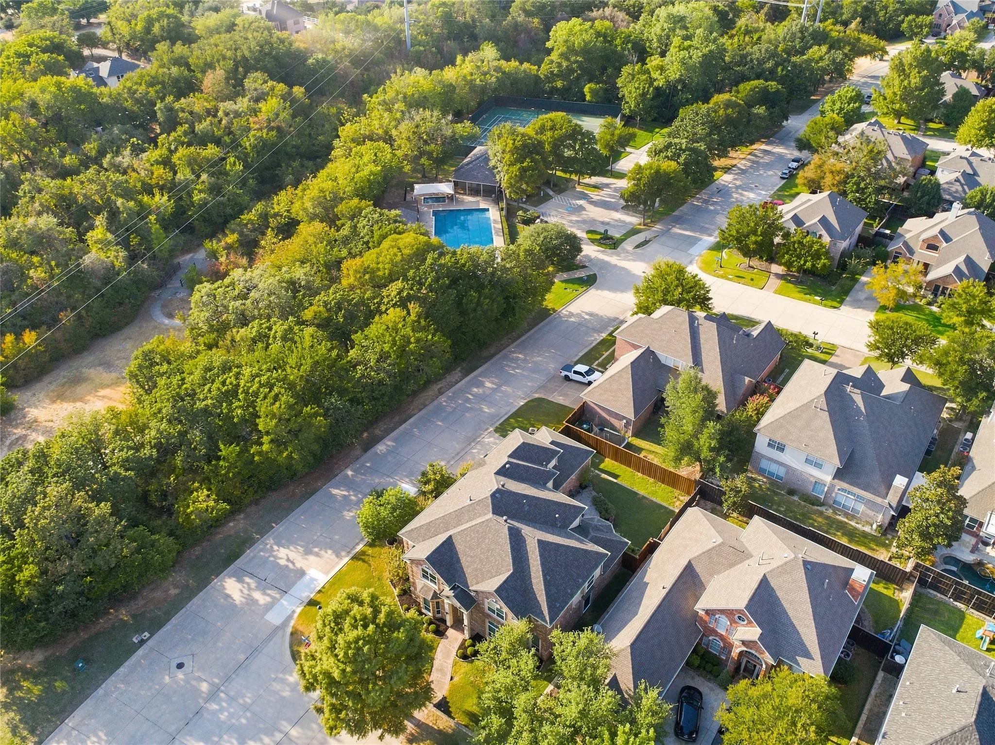 Incredible location right next to community pool, tennis courts, and green space