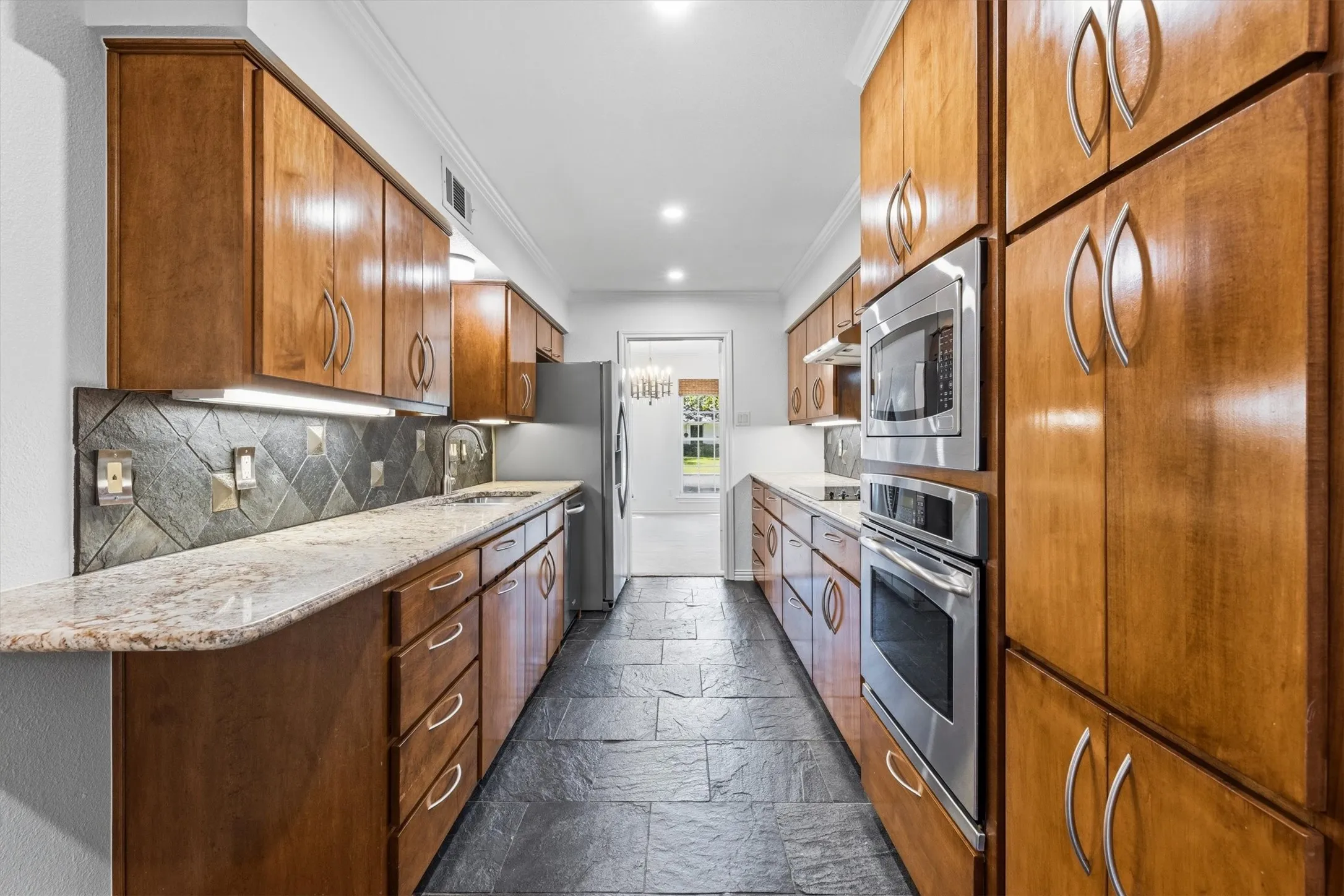 Led can lighting, custom cabinets, abundant storage and counter space...