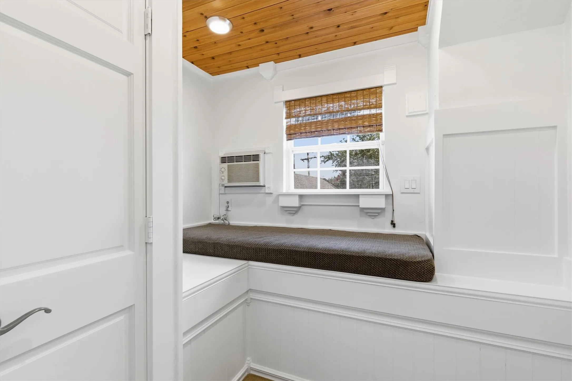 Upstairs bonus room that makes for great reading or meditation space, features beautiful wood plank ceiling and has egress with a closet...