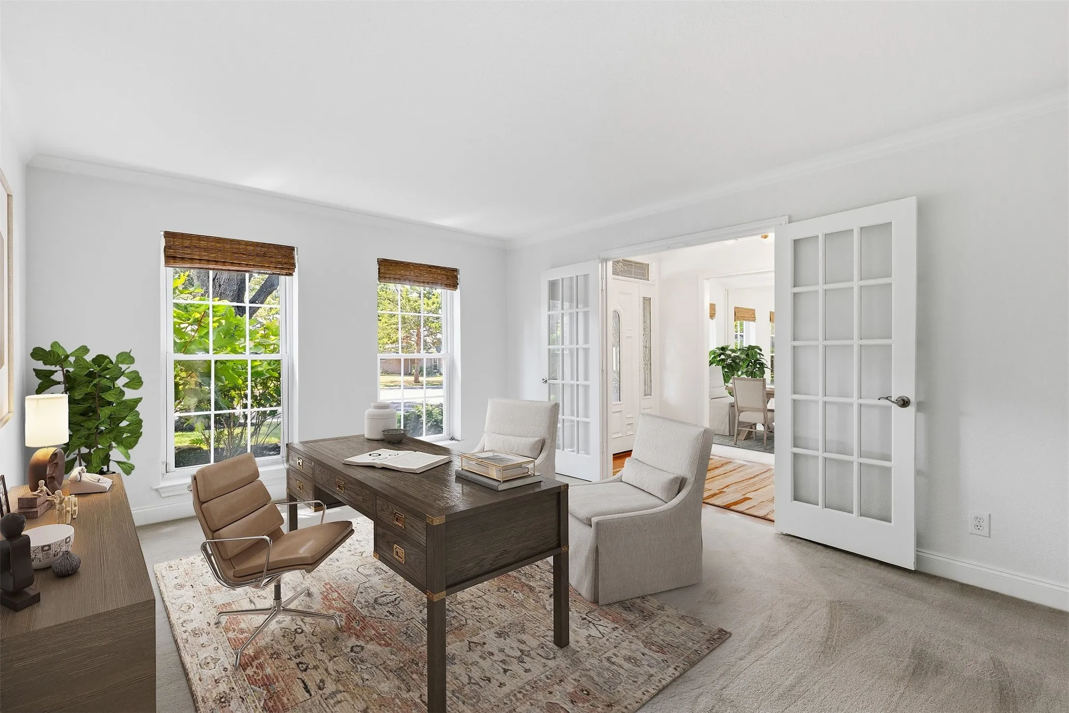 Wonderful front room right off the foyer boasting glass front French doors that makes for a wonderful home office, formal living or other space that suits your needs...*virtually staged to show potential*