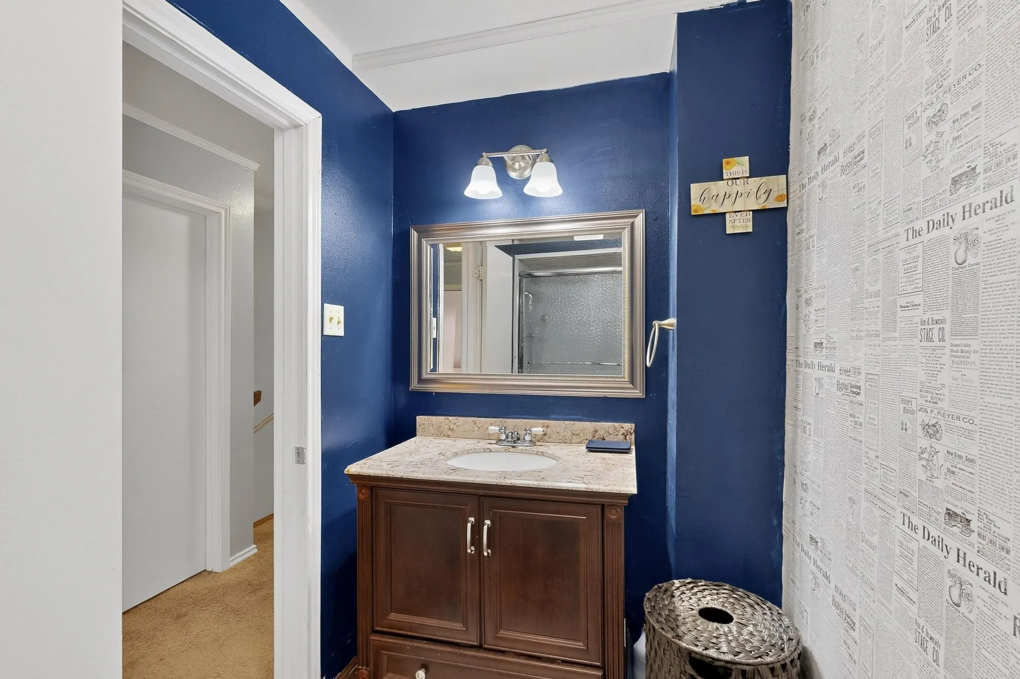 Bathroom featuring vanity and a shower