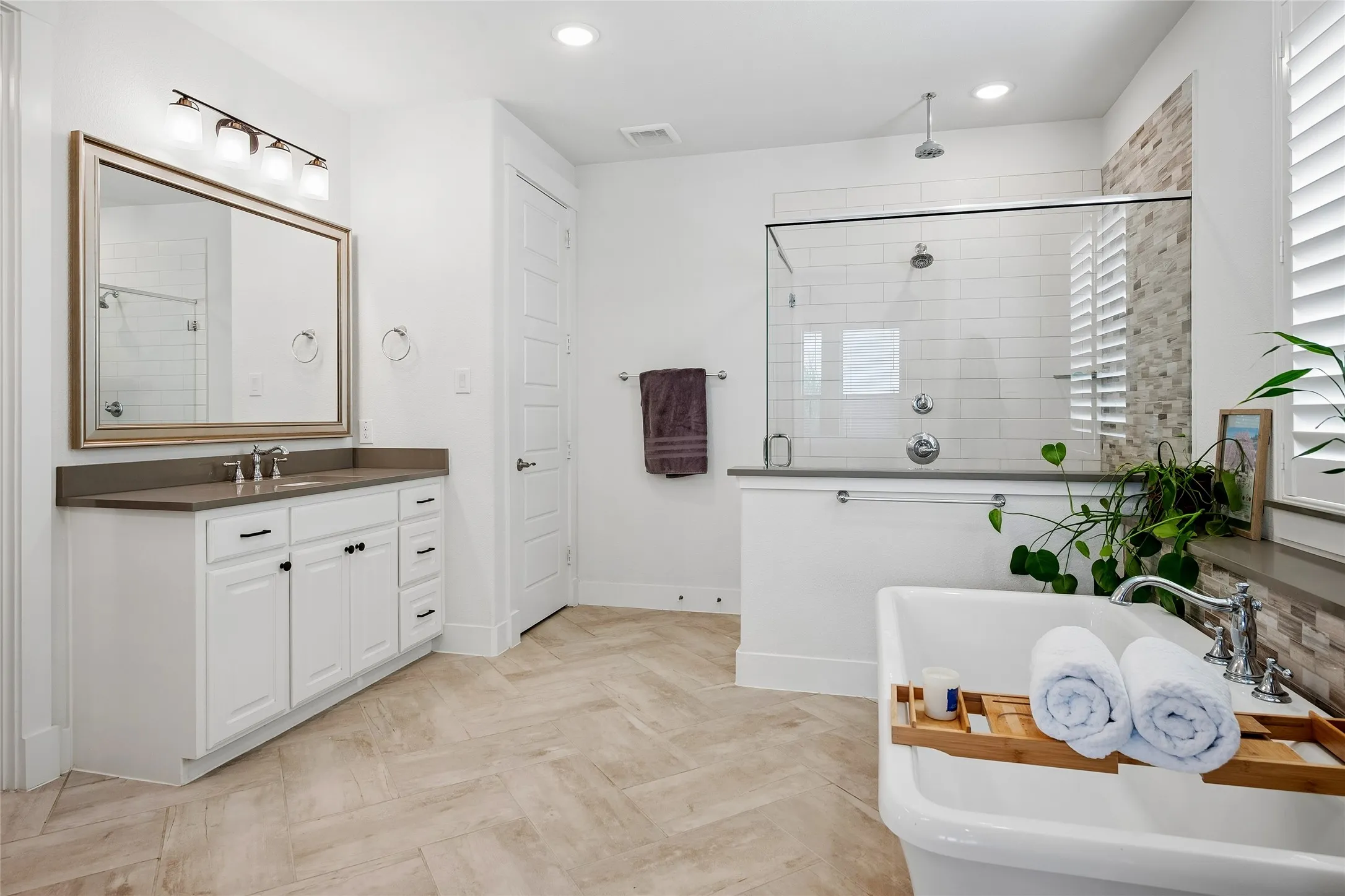 Fabulous bathroom with a soaking tub, separate shower, and double vanities