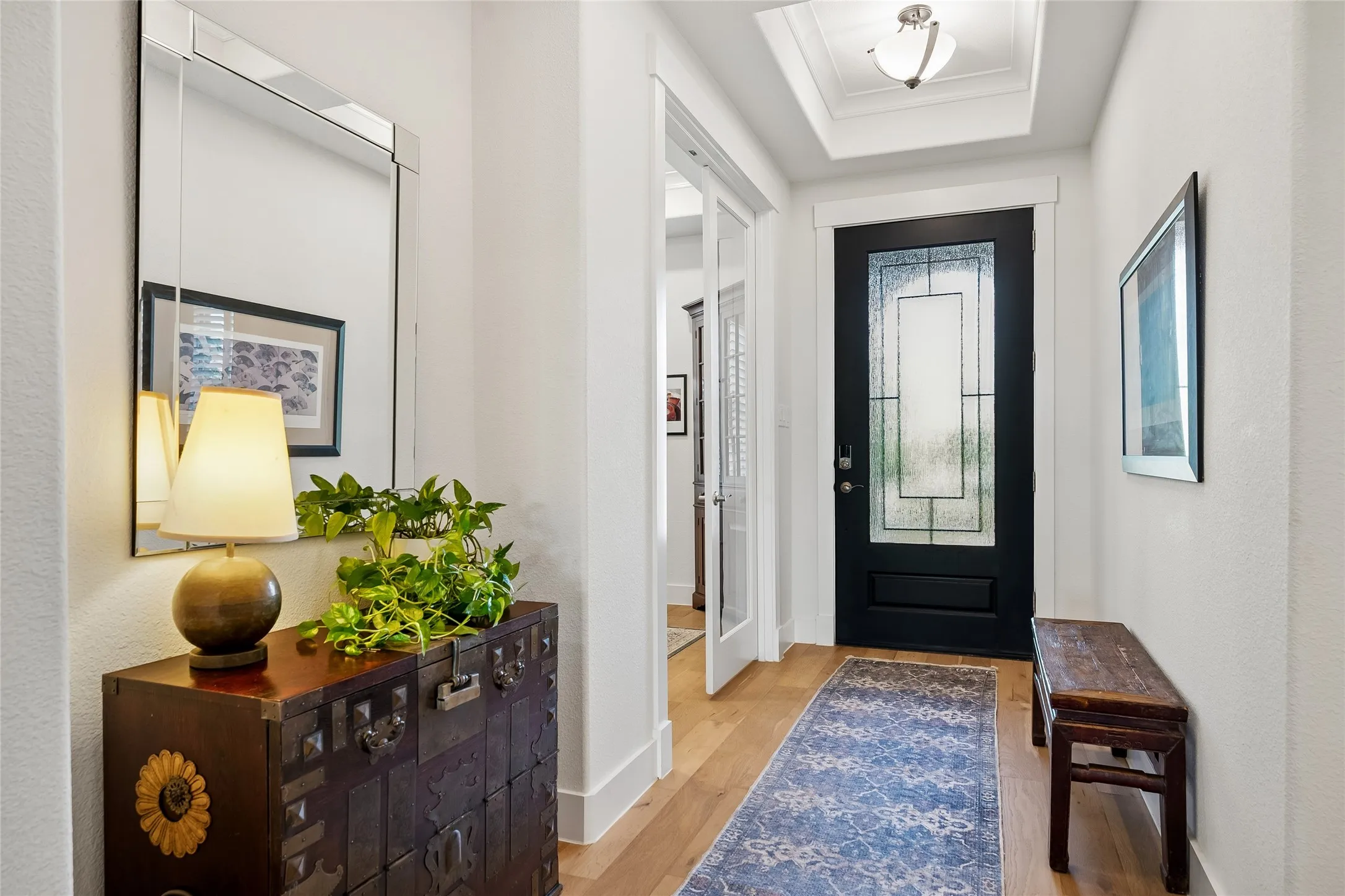 Lovely foyer that shows the door opening to the home office