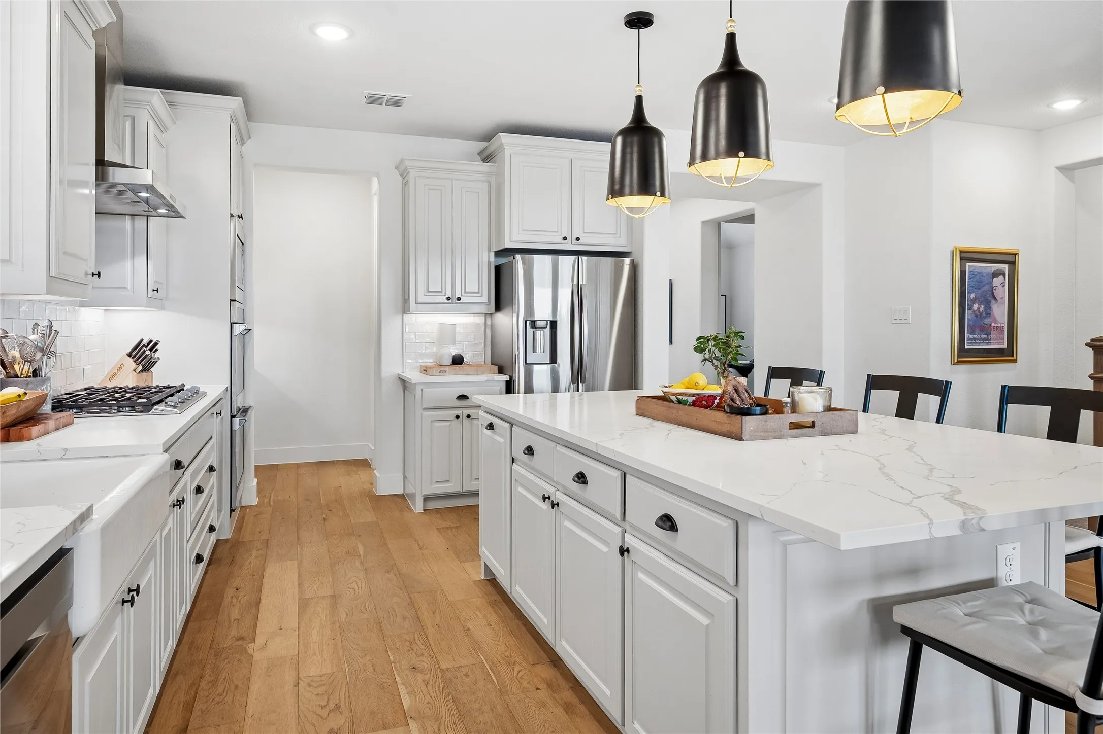 Great kitchen with gas cooktop and farm sink, opens to private coffee bar